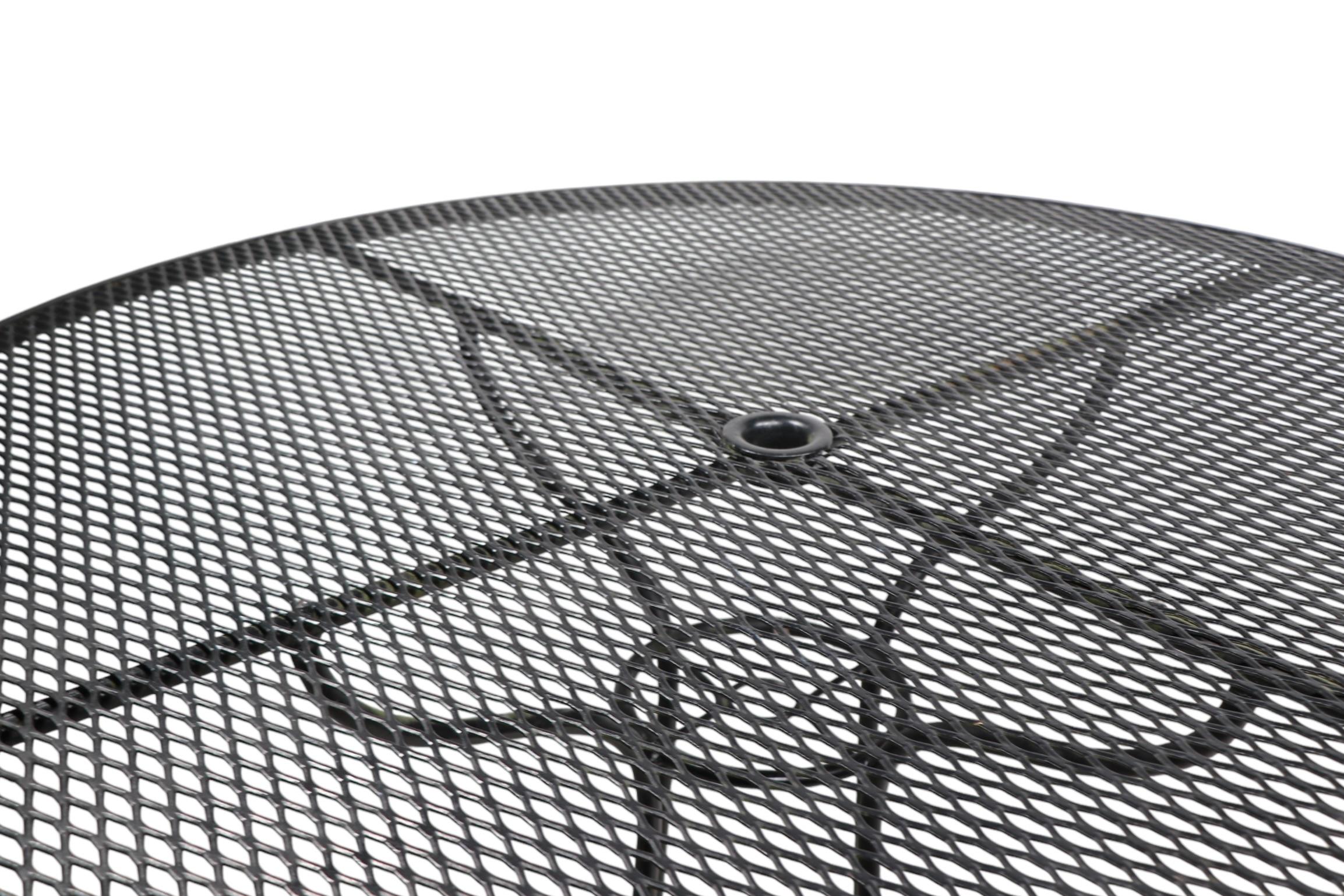 Mid Century Wrought Iron and Metal Mesh Garden Patio Poolsoide Table For Sale 1