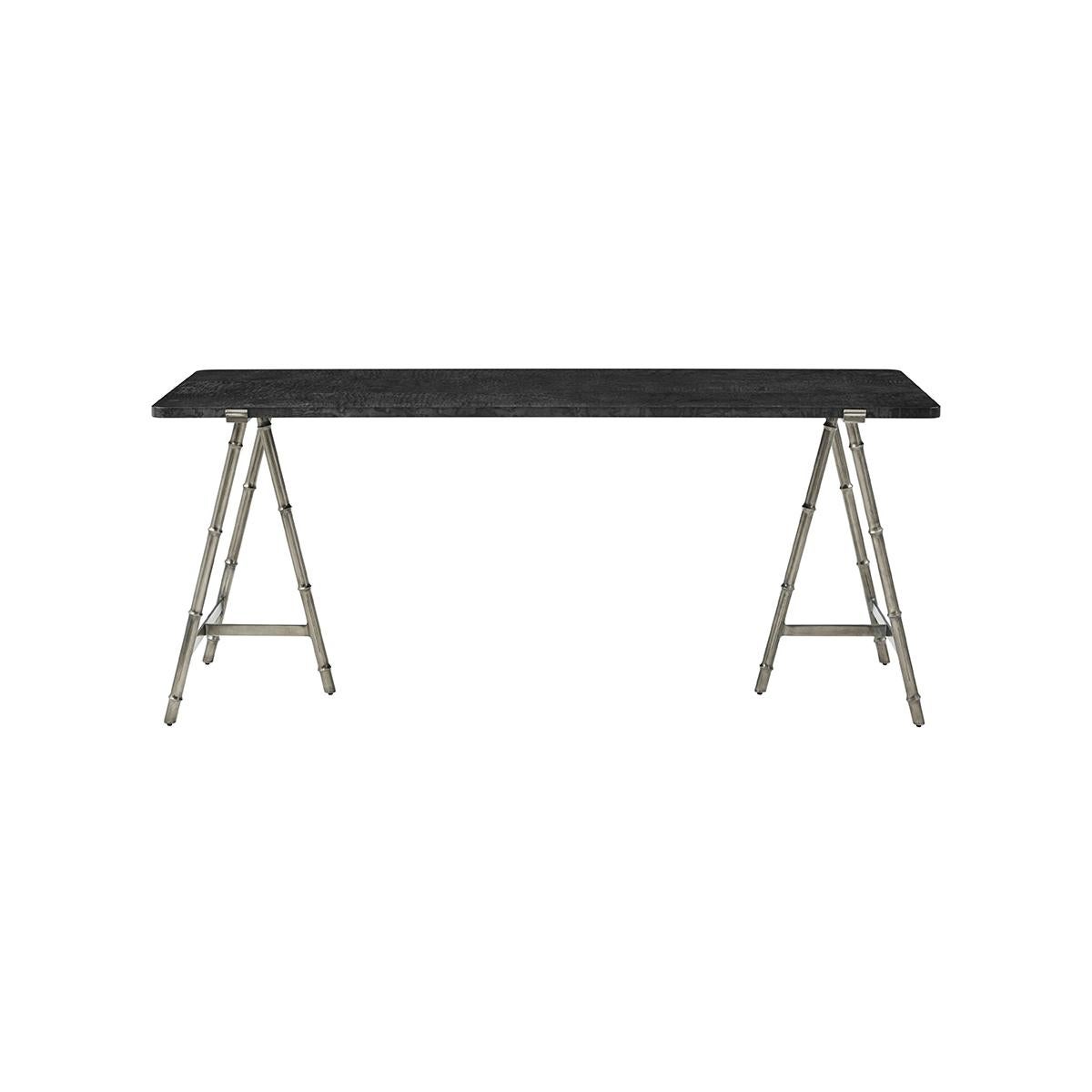 Slender lines form a light and airy design in this modern table. A graceful combination of burl wood in a silent black polished finish atop an organic faux bois base in a silvered bronze finish.

Dimensions: 72
