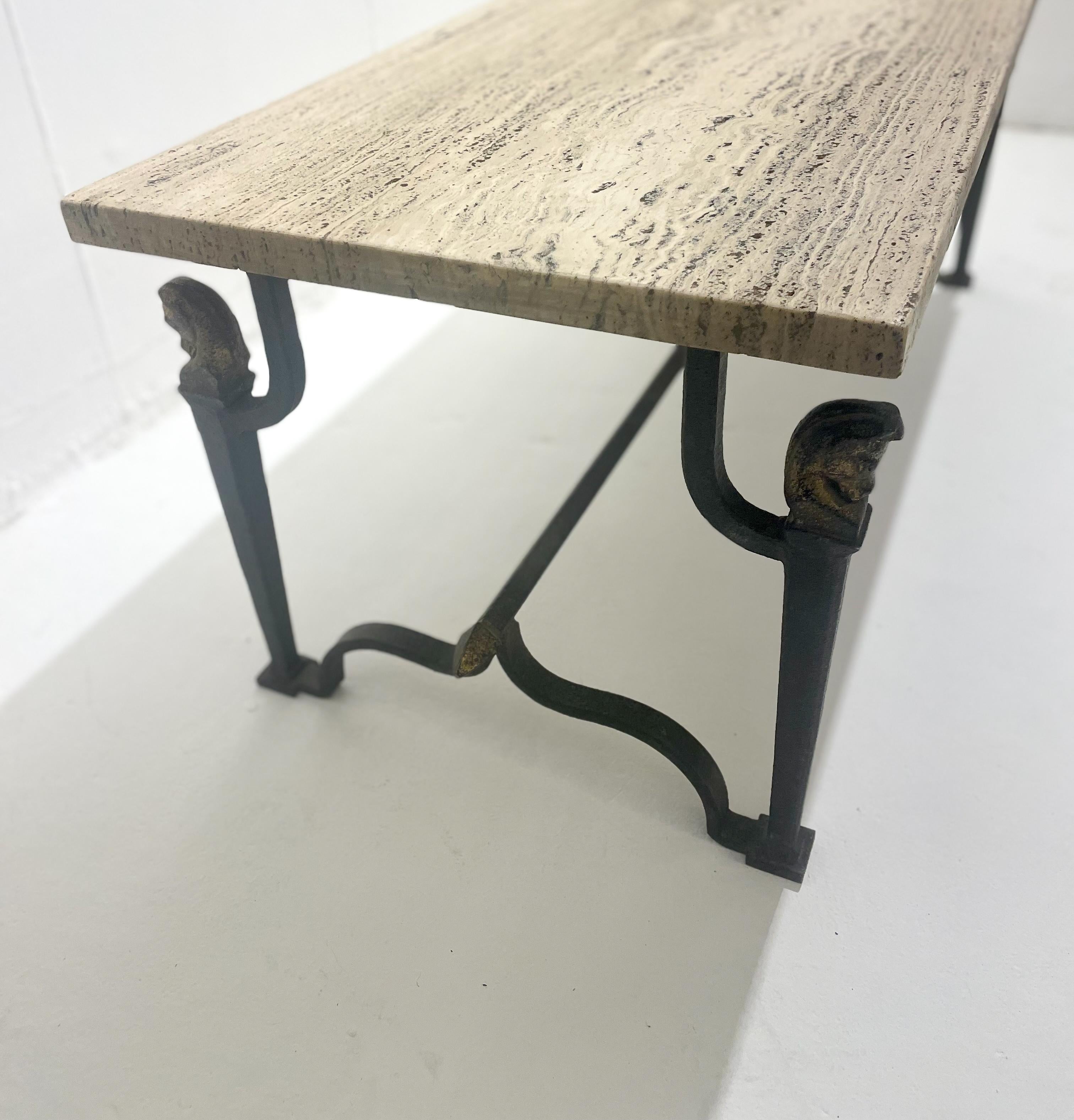 Mid-century wrought iron and travertine coffee table, 1940s.