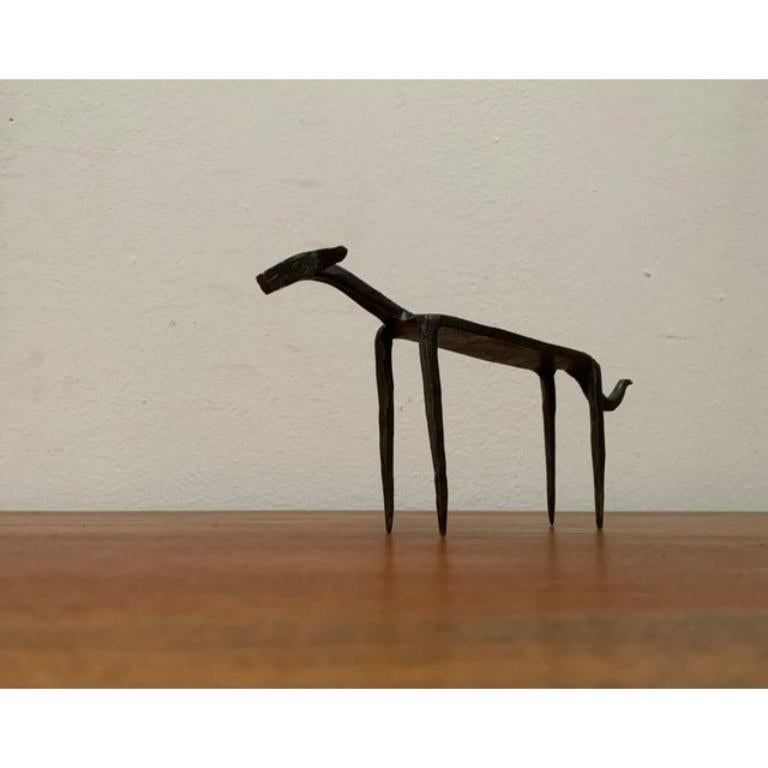 Mid-Century Wrought Iron Animal Sculpture, in Very Good conditions. Designed 1960 to 1969.

Additional information:
Color: Black
Styles: Mid-Century Modern
Art Subjects: Animals
Item Type: Vintage, Antique or Pre-owned
Diamension: 9.84ʺW × 1.18ʺD ×