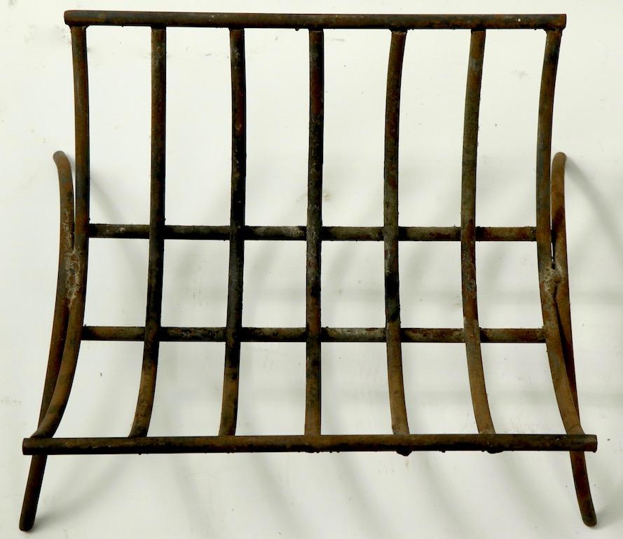 Architectural wrought iron fireplace grate, log holder. Unusual curved basket like form, graphic design, good ready to use condition.
