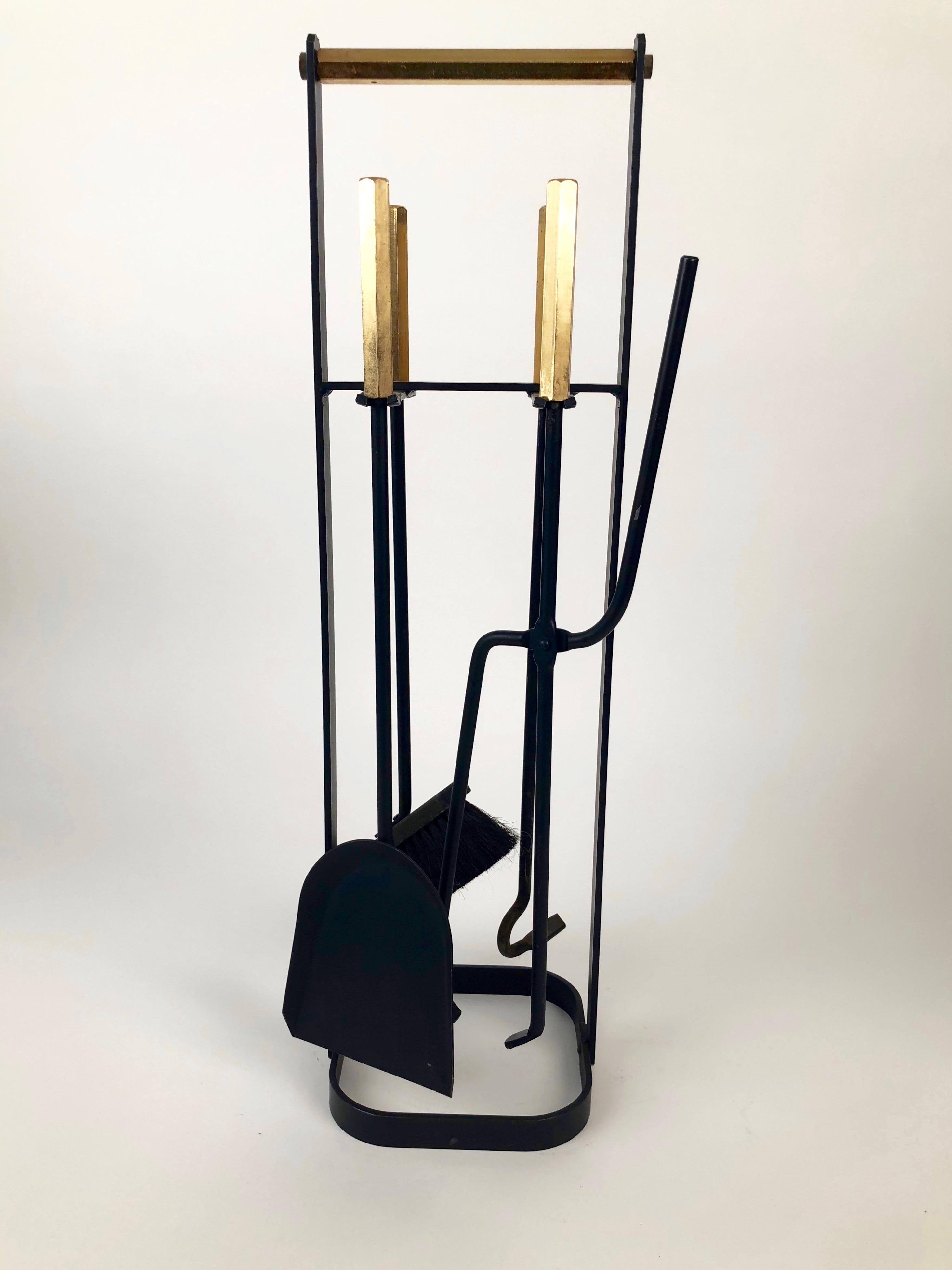 A vintage set of fireplace tools in black iron with brass handles from the 1960s.
Tools include : broom, shovel, poker and tongs. All pieces in very good condition.