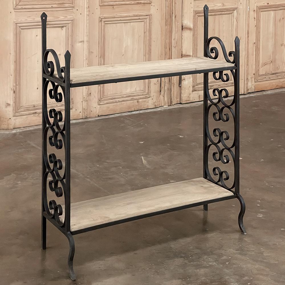 Midcentury Wrought Iron & Oak Plank Open Bookshelf combines timeless flair with elegant scrollwork created from the deft hands of a talented metalsmith, with a shallow design ideal for cozy rooms, hallways, stairwell landings and the like. Two