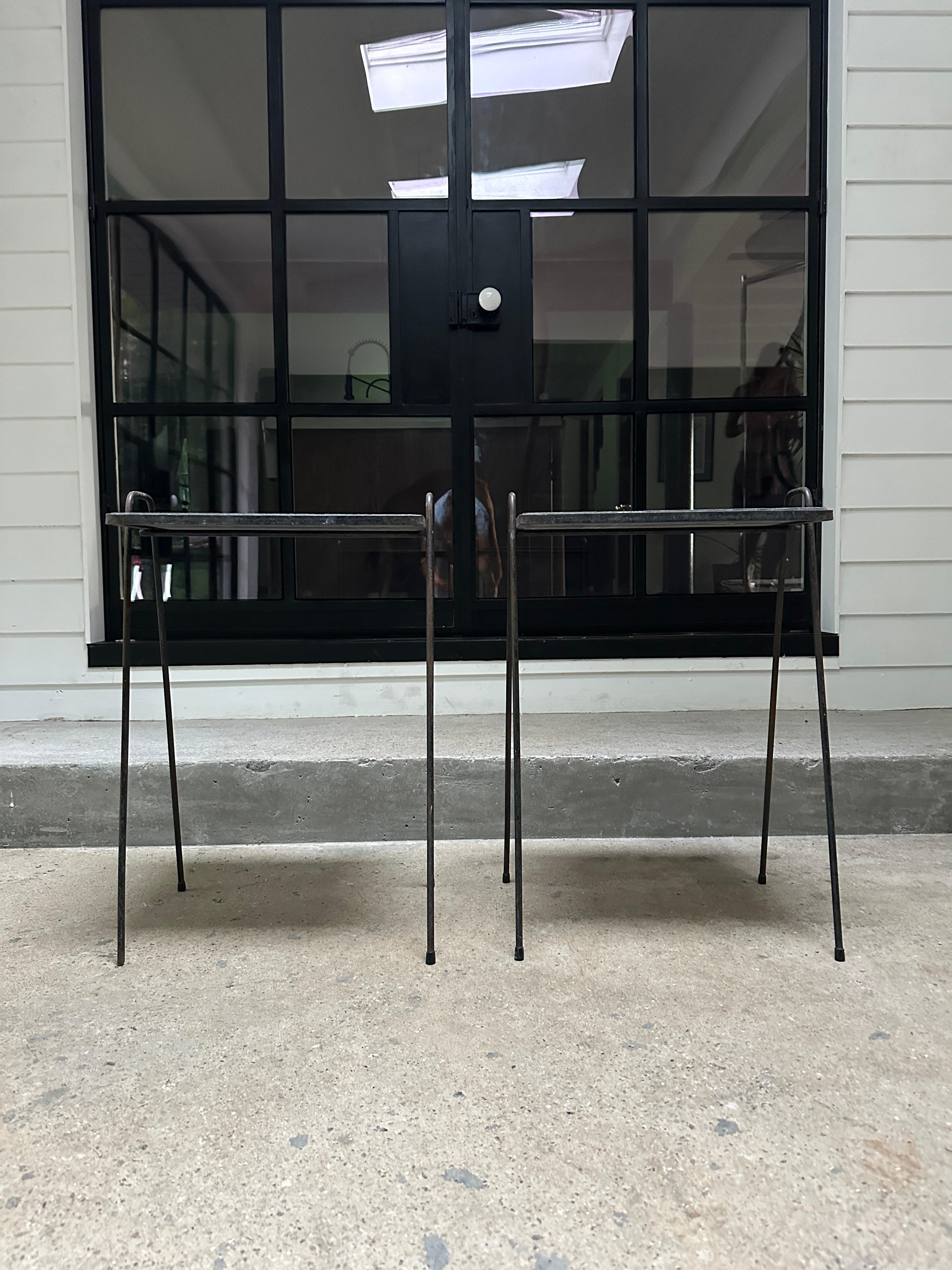 A set of 2 mid century wrought iron tables with slate board tops. Kept in original condition for a beautiful vintage look.

16.5”W x 12.5D x 24”H

Price is for both tables.