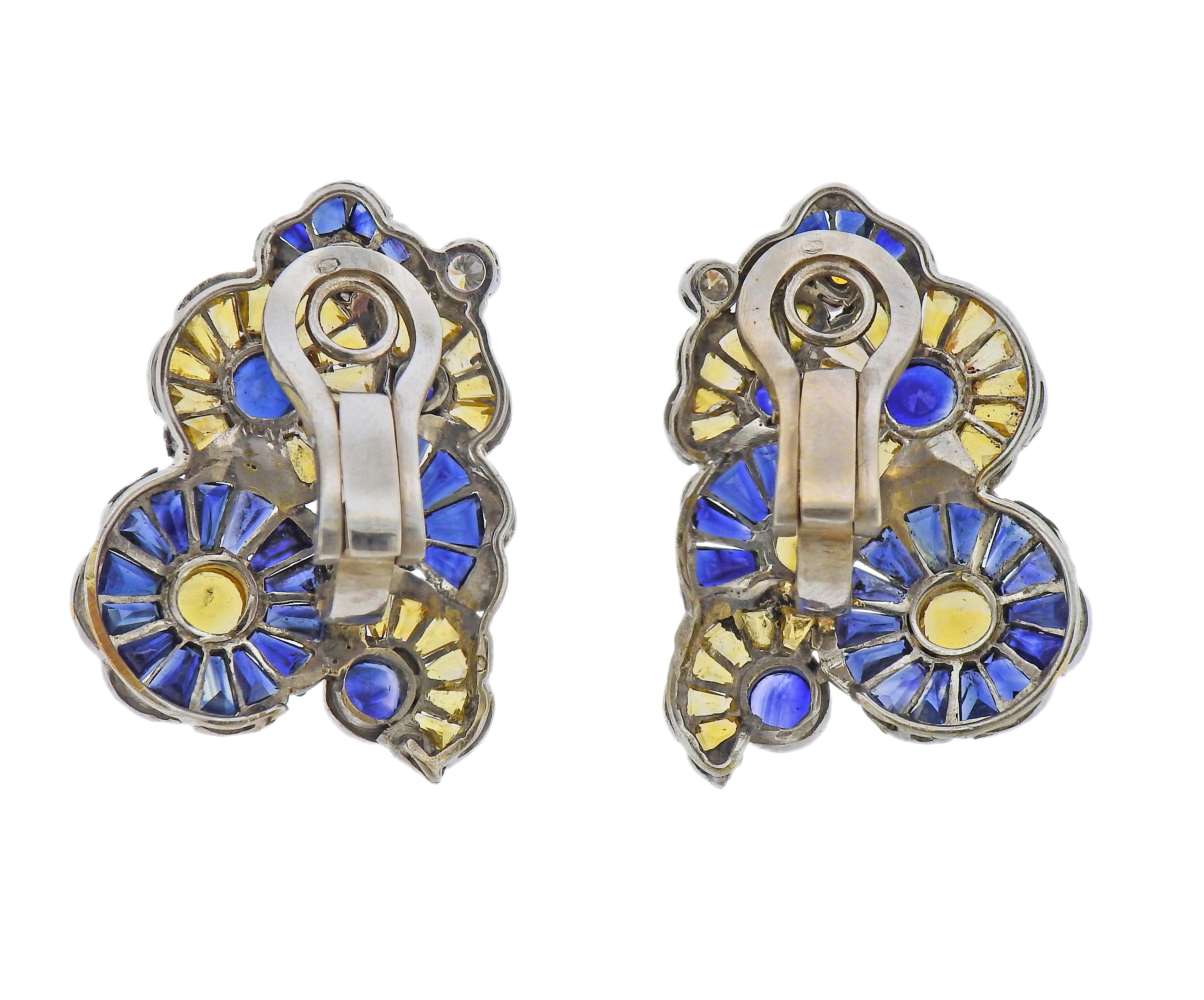 Mid Century 14k gold earring, with blue and yellow sapphires, and approx. 0.14ctw in diamonds. Earrings are 31mm x 23mm. Marked with gold mark on the backs. Weight - 16.4 grams.