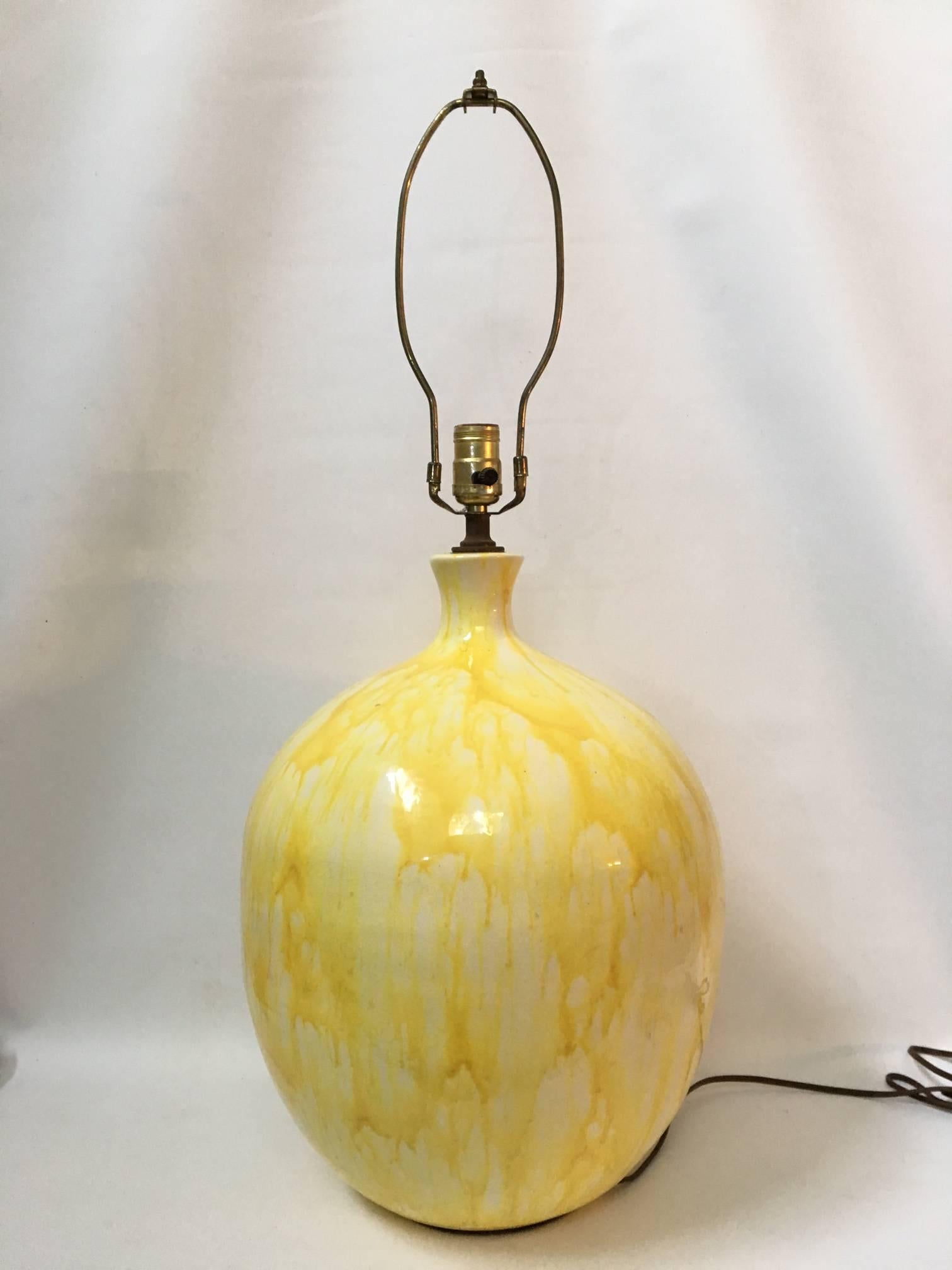 Drips of bright yellow glaze give this midcentury lamp a very unique look. Perfect for your Hollywood Regency decor. Excellent vintage condition.
