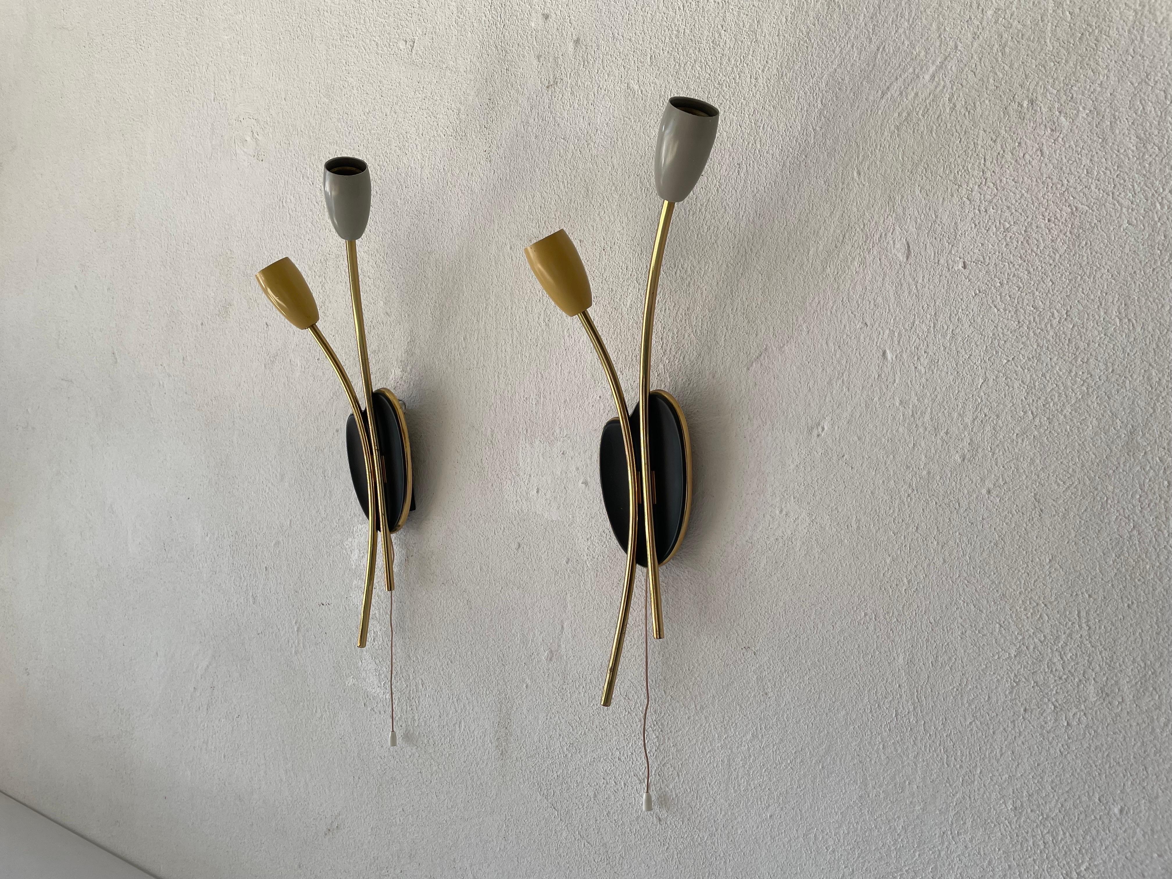 Mid-century yellow-grey pair of sputnik sconces, 1950s, Germany

Very elegant and Minimalist wall lamps
Lamp is in very good condition.

These lamps works with E14 standard light bulbs. 
Wired and suitable to use in all countries. (110-220