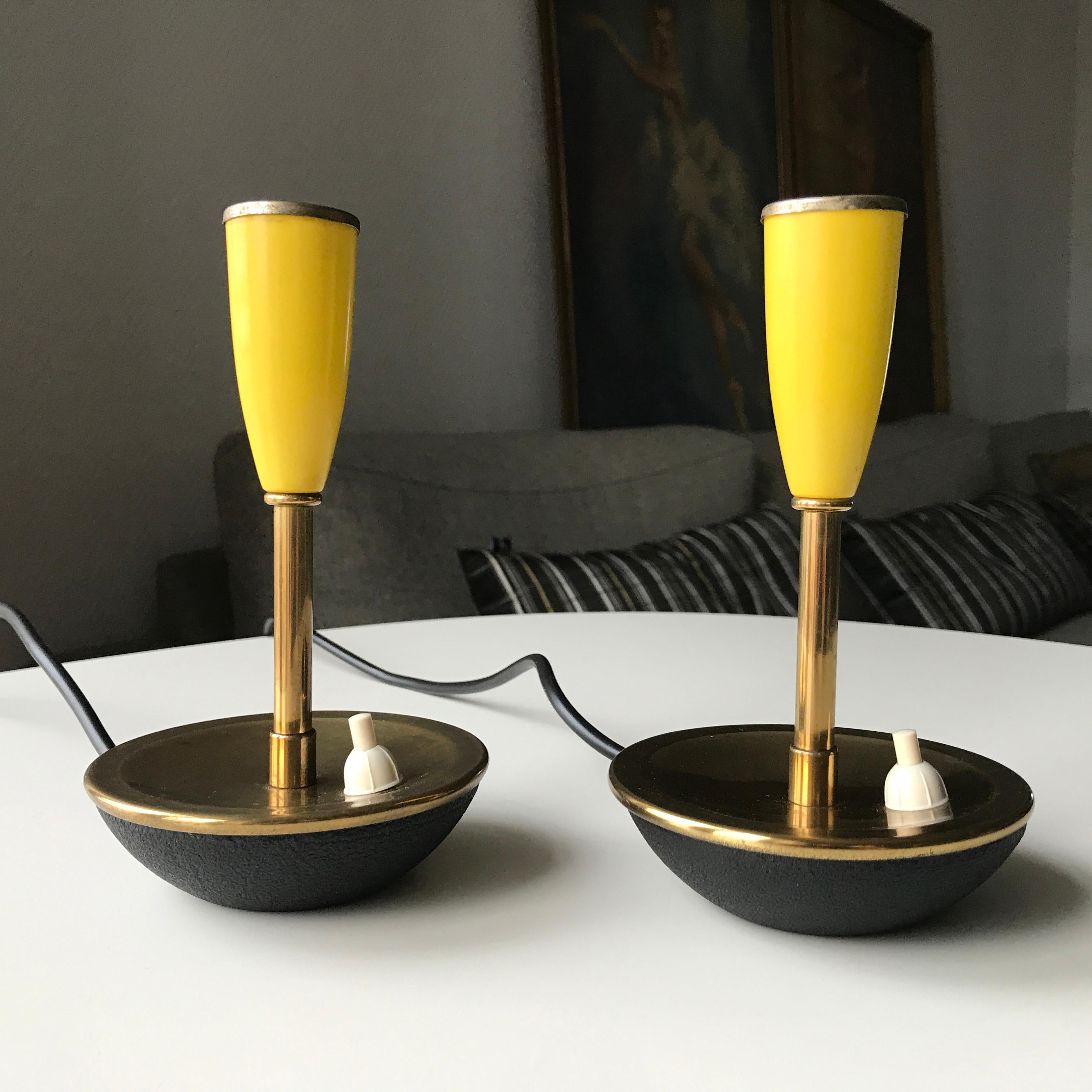 Mid-Century Pair of yellow Scandinavian Modern design desk lamps. Black rough surface bottom base. Top surface and tube in brass. Pipe in yellow laquer with trim ring in brass. New wirings. E14 bulb socket holder. No logotype or marking. Based on my