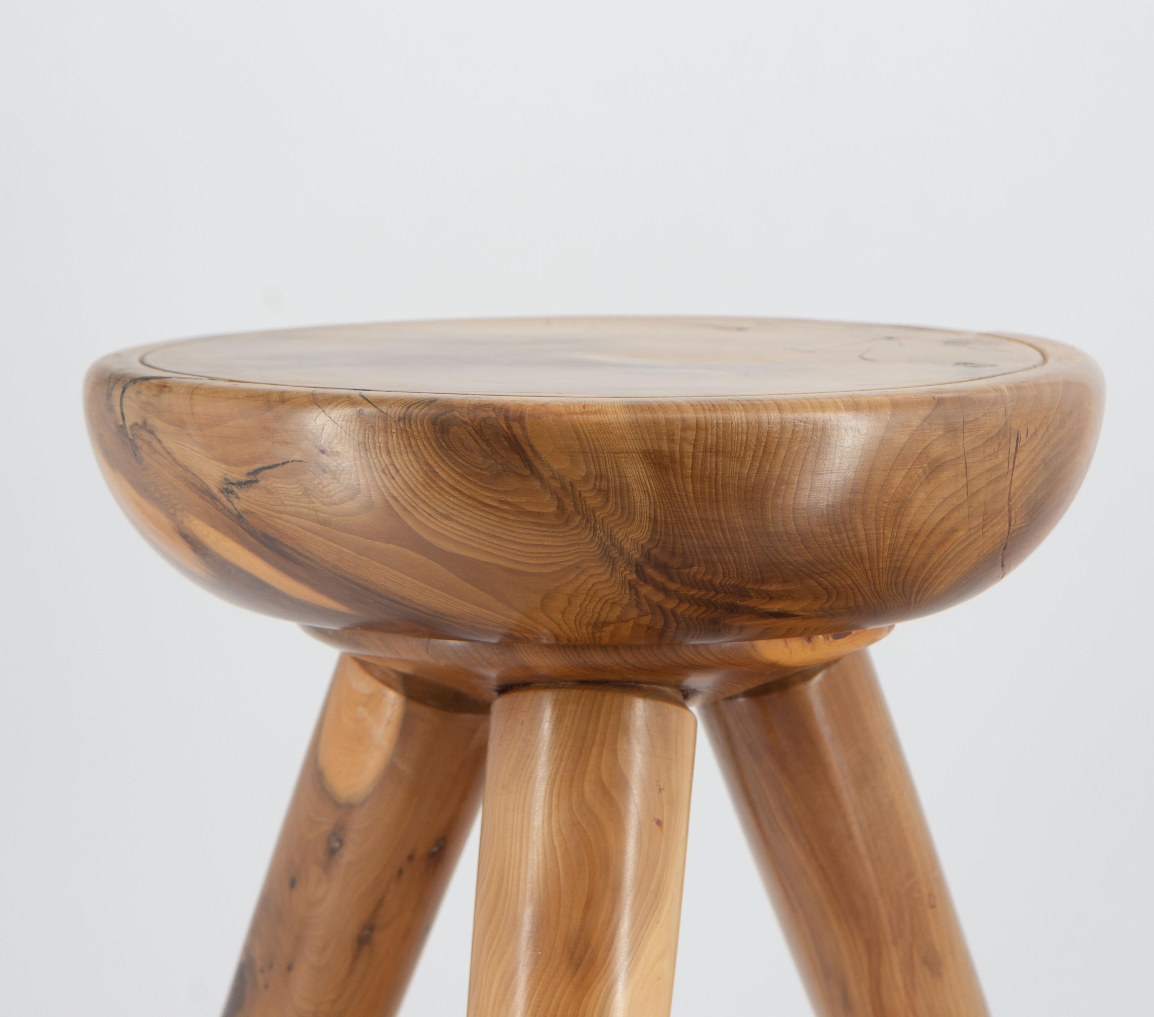 A charming midcentury yew alpine inspired low table/stool, in a Charlotte Perriand manner. circa 1960.

Very tactile feel, made in solid yew and showing wonderful grain and natural shakes in the wood. It is very sturdy and has no loose joints.