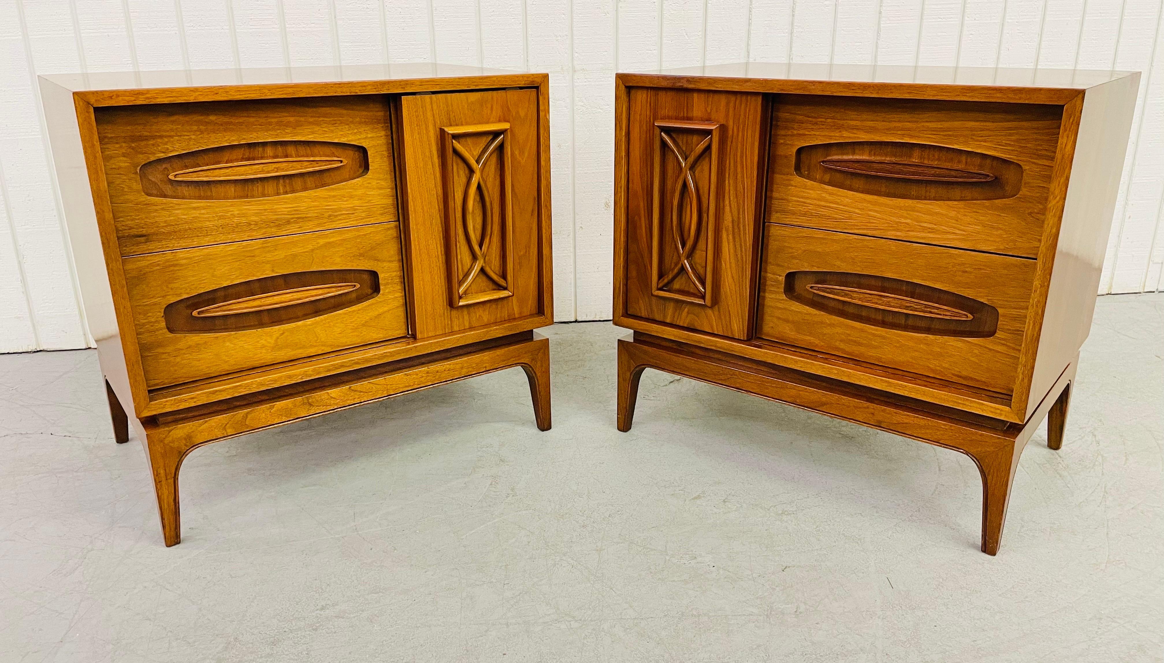 This listing is for a pair of mid-century Young MFG walnut nightstands. Featuring a sliding door, a glass shelf, two drawers for storage, and a beautiful walnut finish.