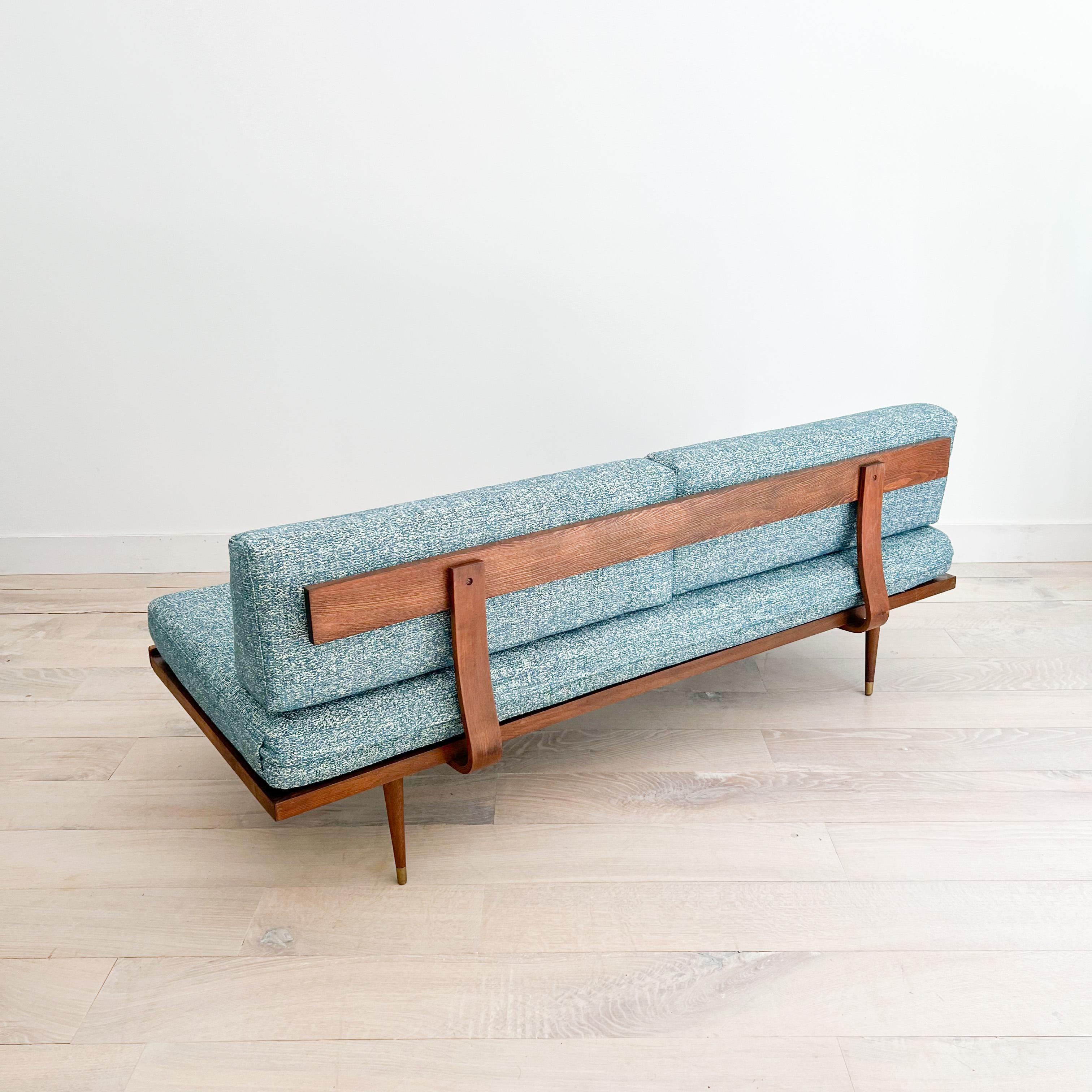 Mid-Century Modern sofa/daybed - made in Yugoslavia. New foam and soft blue/white upholstery. Some light scuffing/scratching to the wooden frame from age appropriate wear. The original webbing is in good condition.