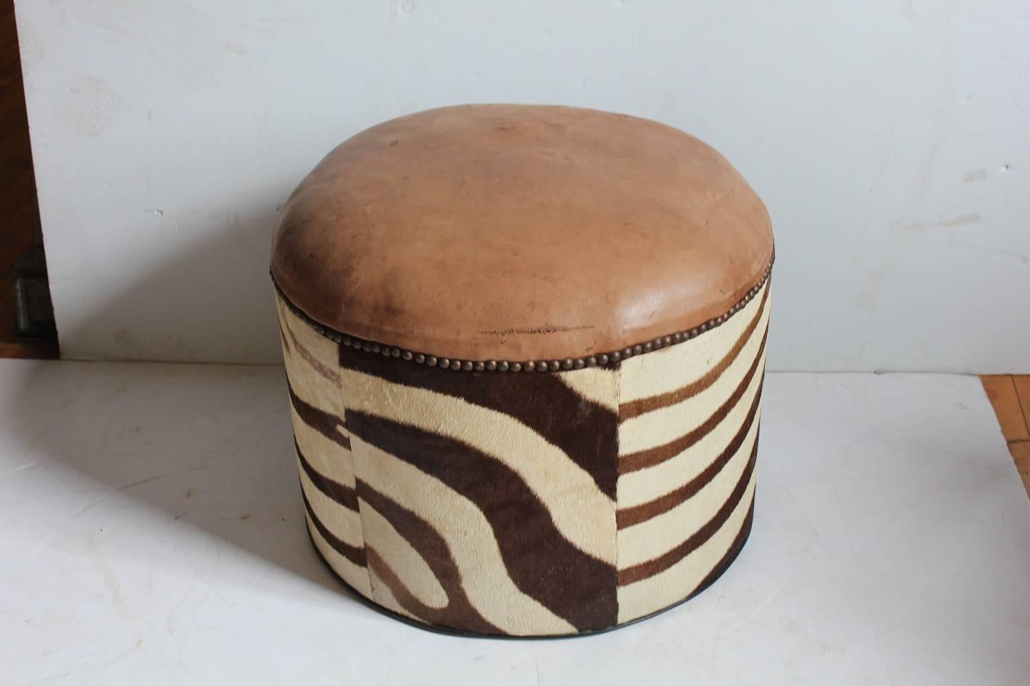 Midcentury zebra hide stool with leather top. Original condition.