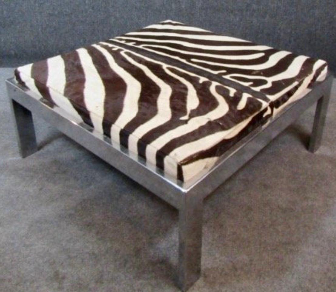 Vintage, C.1970s large Zebra hide Ottoman on a straight line square Chrome base..
There a a few repairs that are hand stitched, to the hide, very well done..
The Chrome base is in very good condition.
Very good vintage condition consistent with age