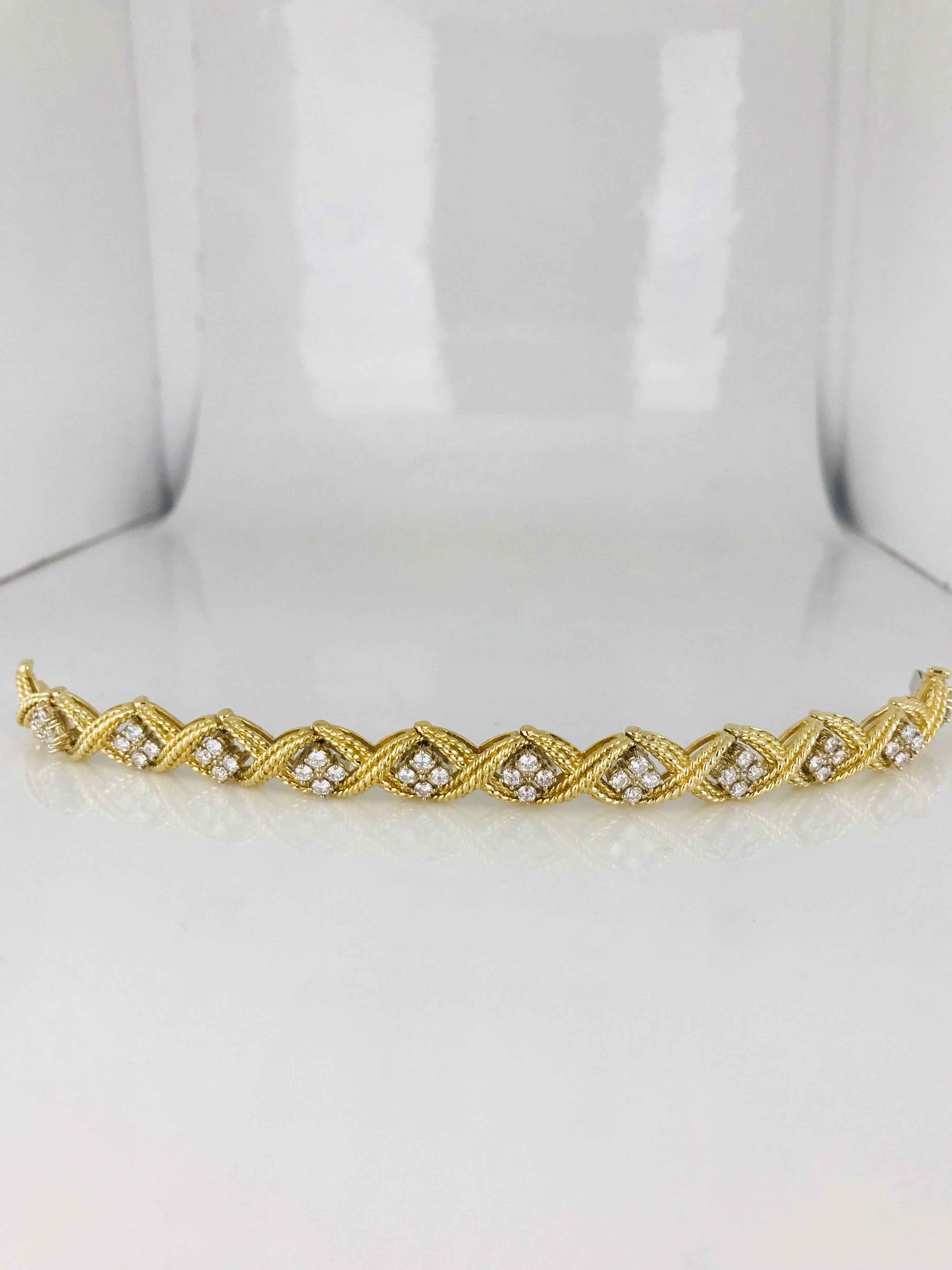 14 karat, Mid Century diamond bracelet, with over 3.00 carats of diamonds. A total of (44) round brilliant-cut diamonds average to 2.70 millimeters in diameter having a total weight of approximately 3.00 carats. 
The gold is heavy weighing 39.9