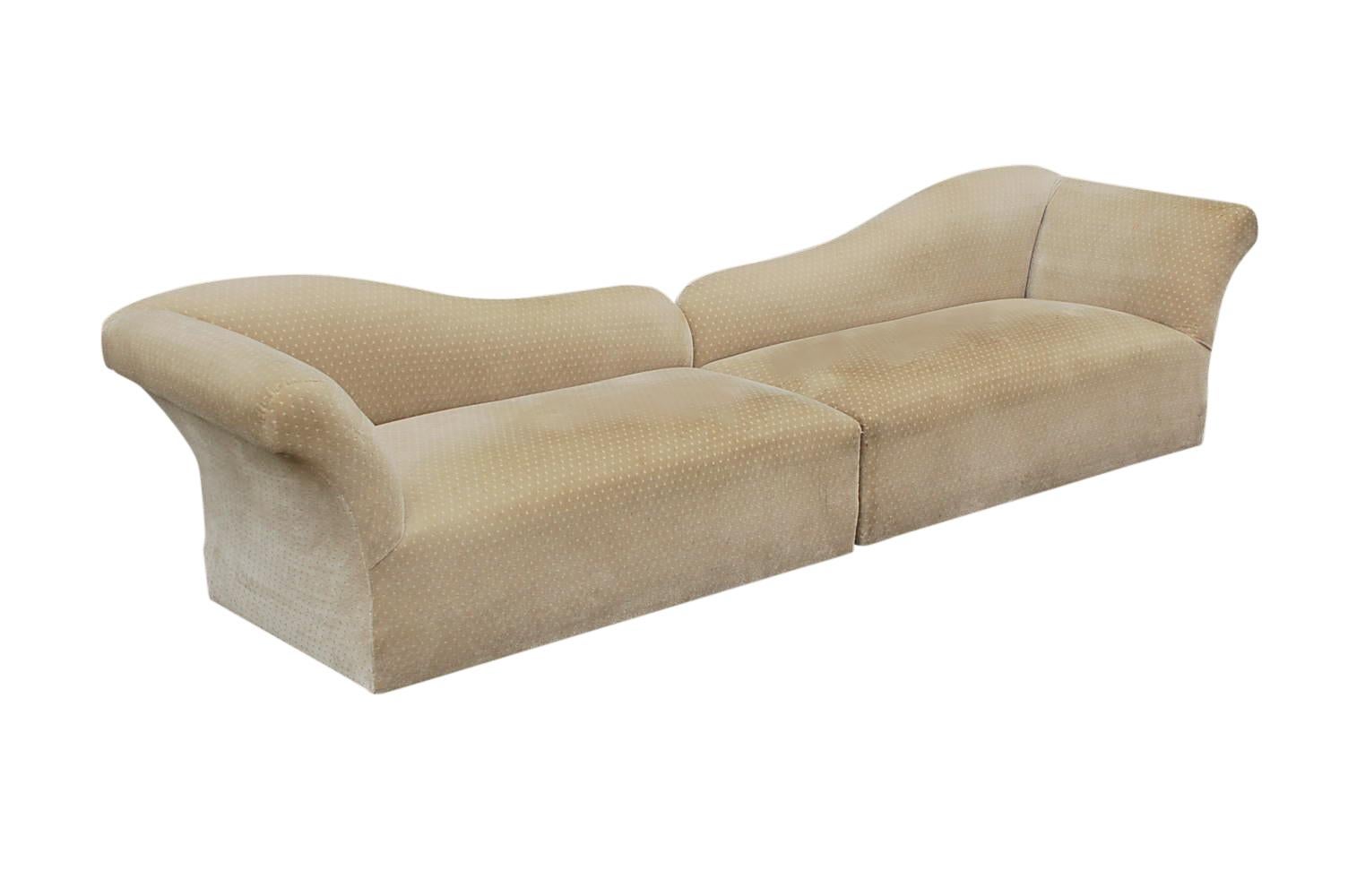A transitional modern 2 piece long sofa or pair of chaise lounges. These feature their original upholstery from the 1970s which is soiled and needs recovering. Padding and foam are in great condition.