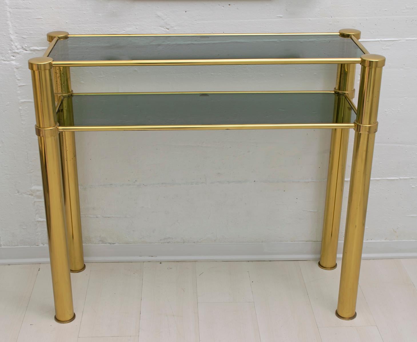 Mid-Century Modern brass console with two smoked glass shelves and coordinated mirror, Italy, 1970

