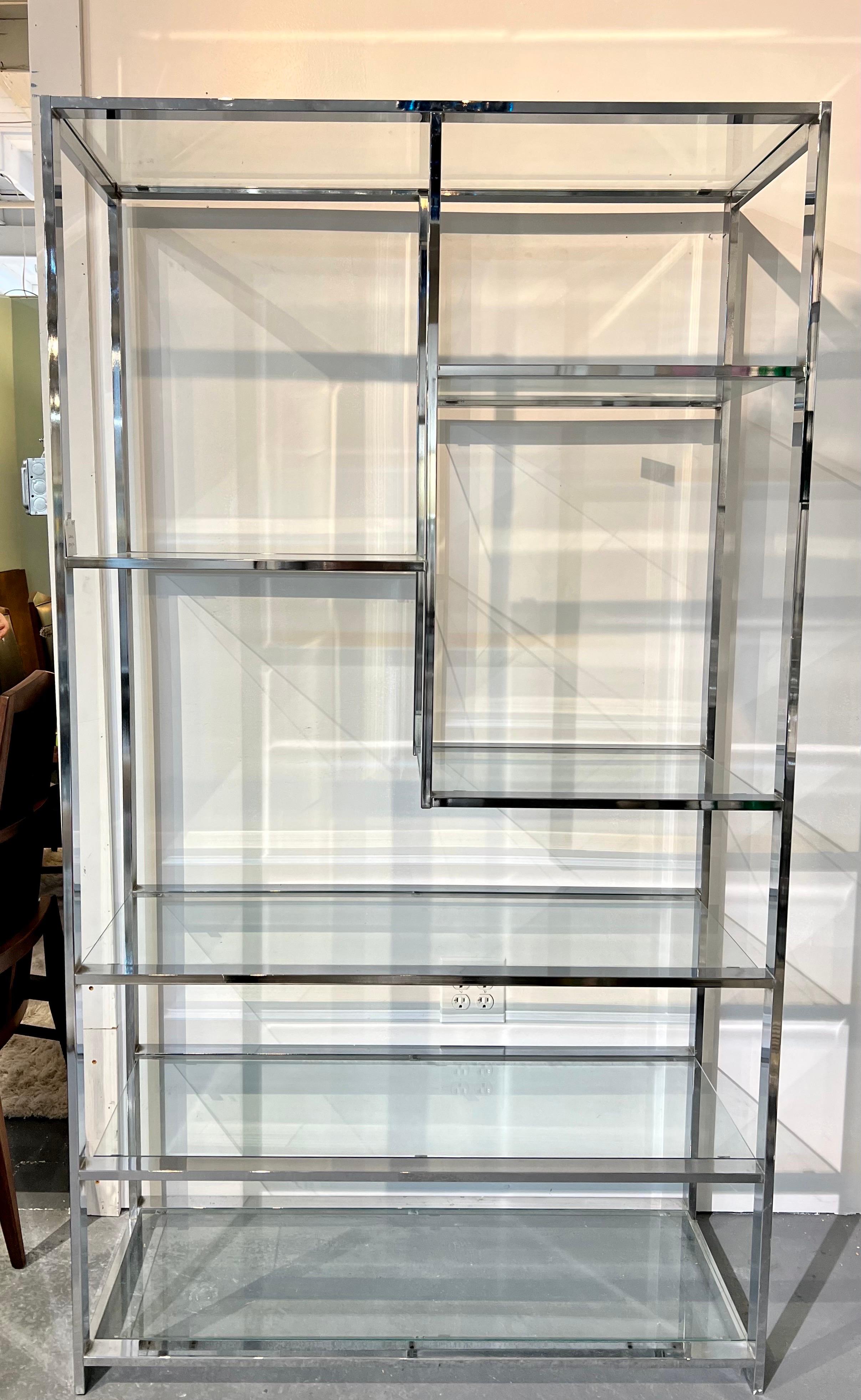 Tall mid-century chrome and glass etagere bookcase with staggered shelving with ample space to display your collectibles, books or picture frames.
