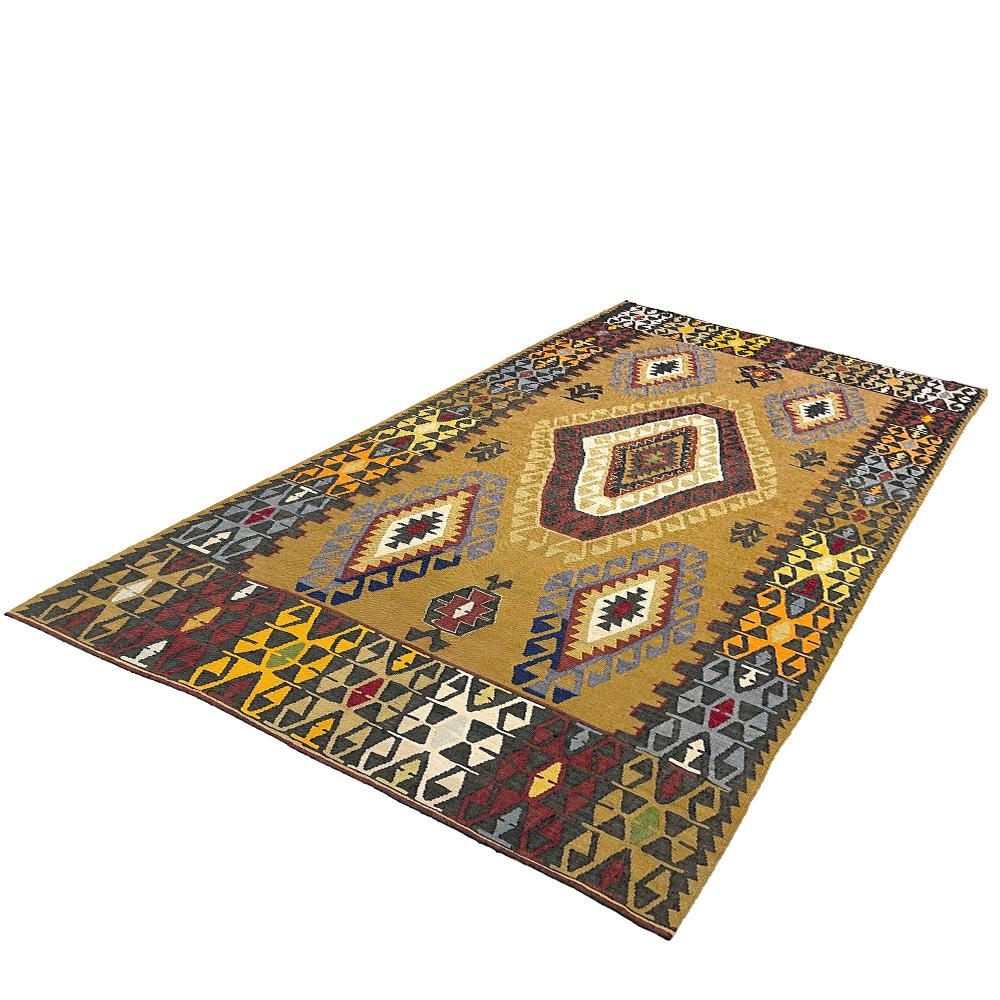 Mid-end-20th century handwoven Anatolian multi-color Kilim

This special Kilim from Turkey was handwoven in the second half of the 20th century. It is lined with a cotton fabric to maintain stability and to protect the fabric of the Kilim.
Every