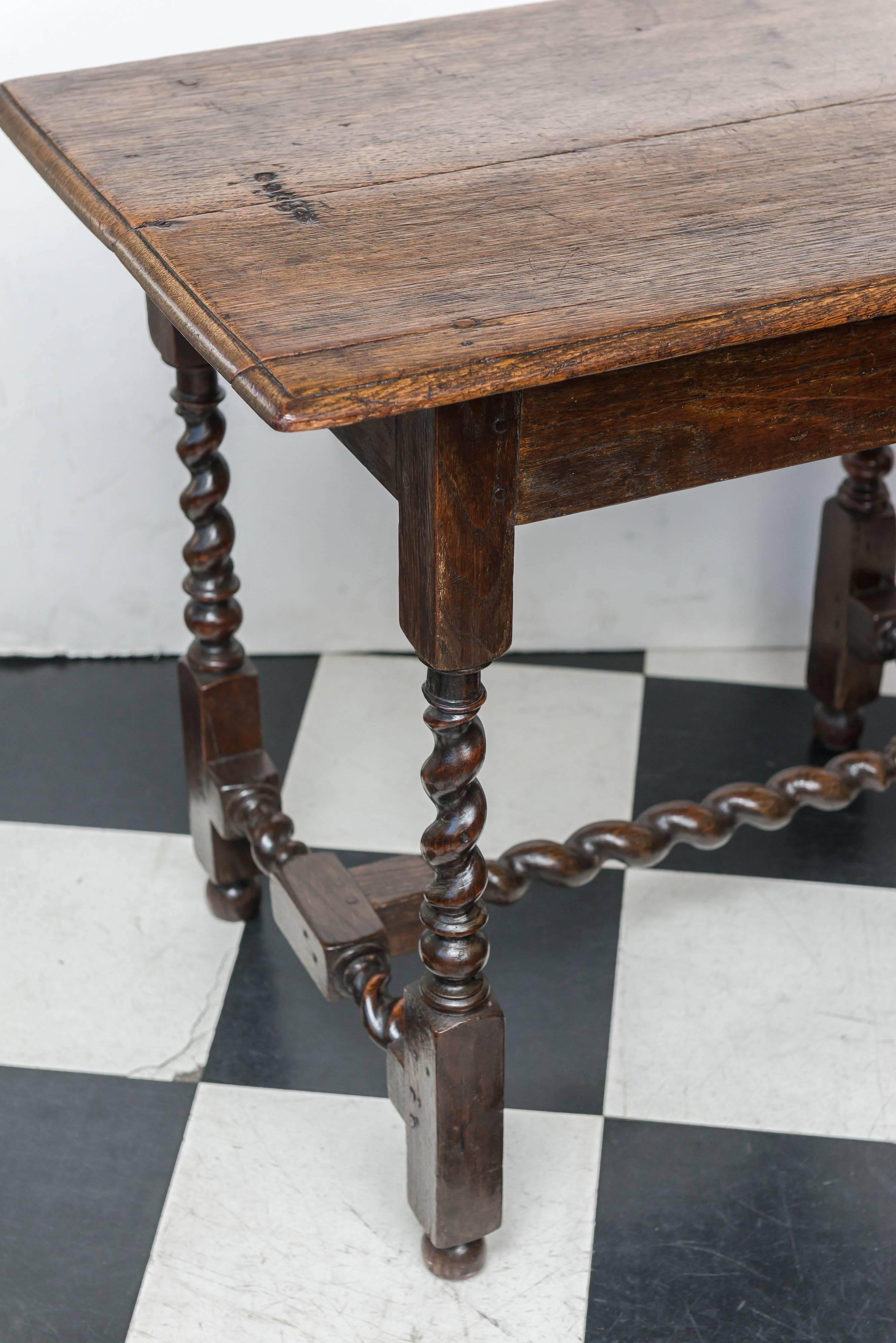 A mid-Georgian twist turned oak side or sofa table, good scale, circa 1750
A good rectangular form of shallow depth. Excellent versatile size for a side, hall or sofa table.
Once having a drawer, now there is none. The old two board top showing