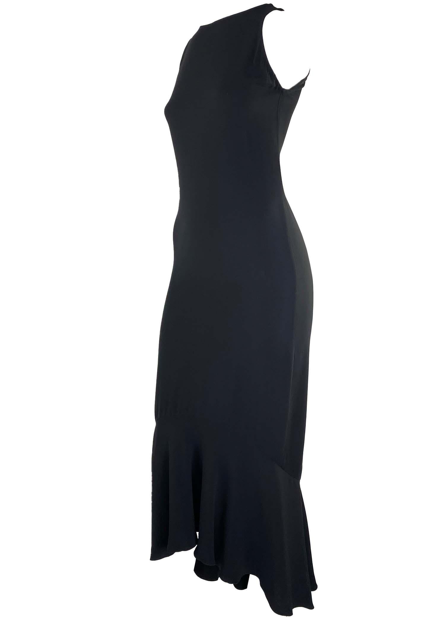 Presenting a vintage midi Gianni Versace dress, designed by Gianni Versace. This is the little black dress your wardrobe is missing. Simple and classy, the design and quality of this piece are impeccable. The dress features a fitted body capped with
