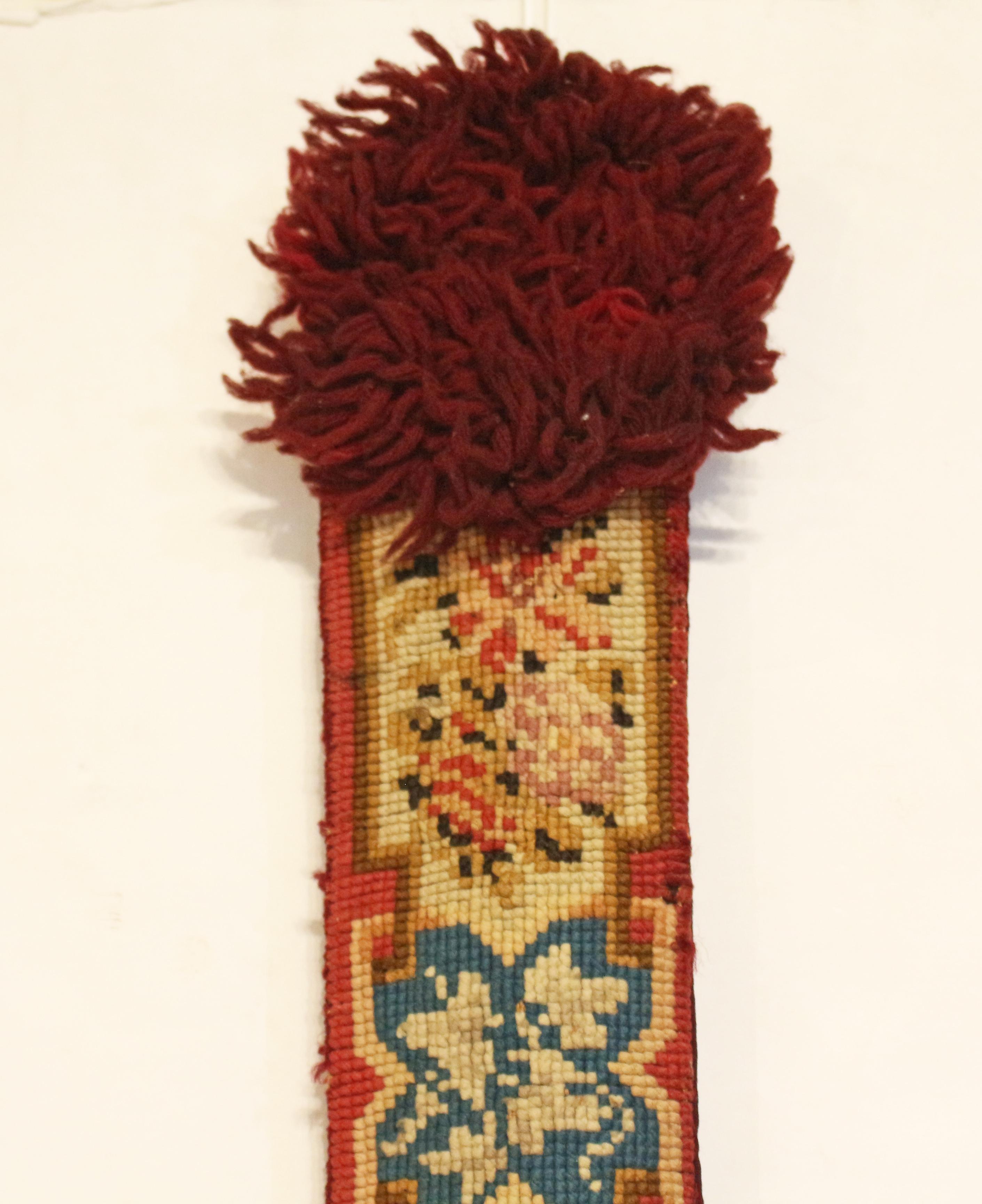 Mid-late 19th century English needlepoint bell pull. A very rare & splendid example with gilt bronze lion mask mounts; maroon backing. Floral, floret & geometric motifs.
75