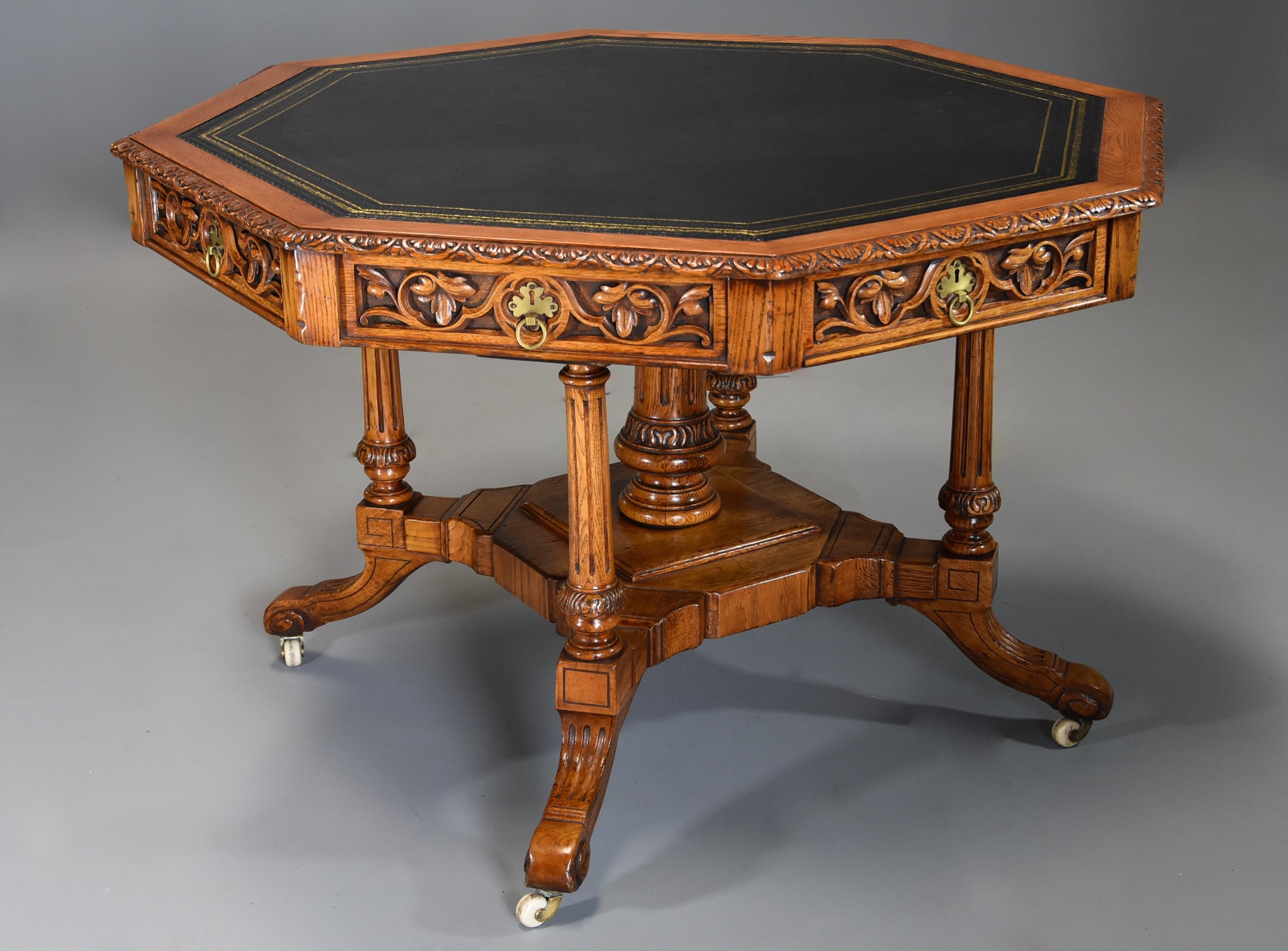 A mid-late 19th century oak octagonal library table by T.H. Filmer & Sons, Oxford St, London.

This unusual library table consists of a black tooled leather top surrounded by a crossbanded and carved oak edge.

This leads down to the drawers,