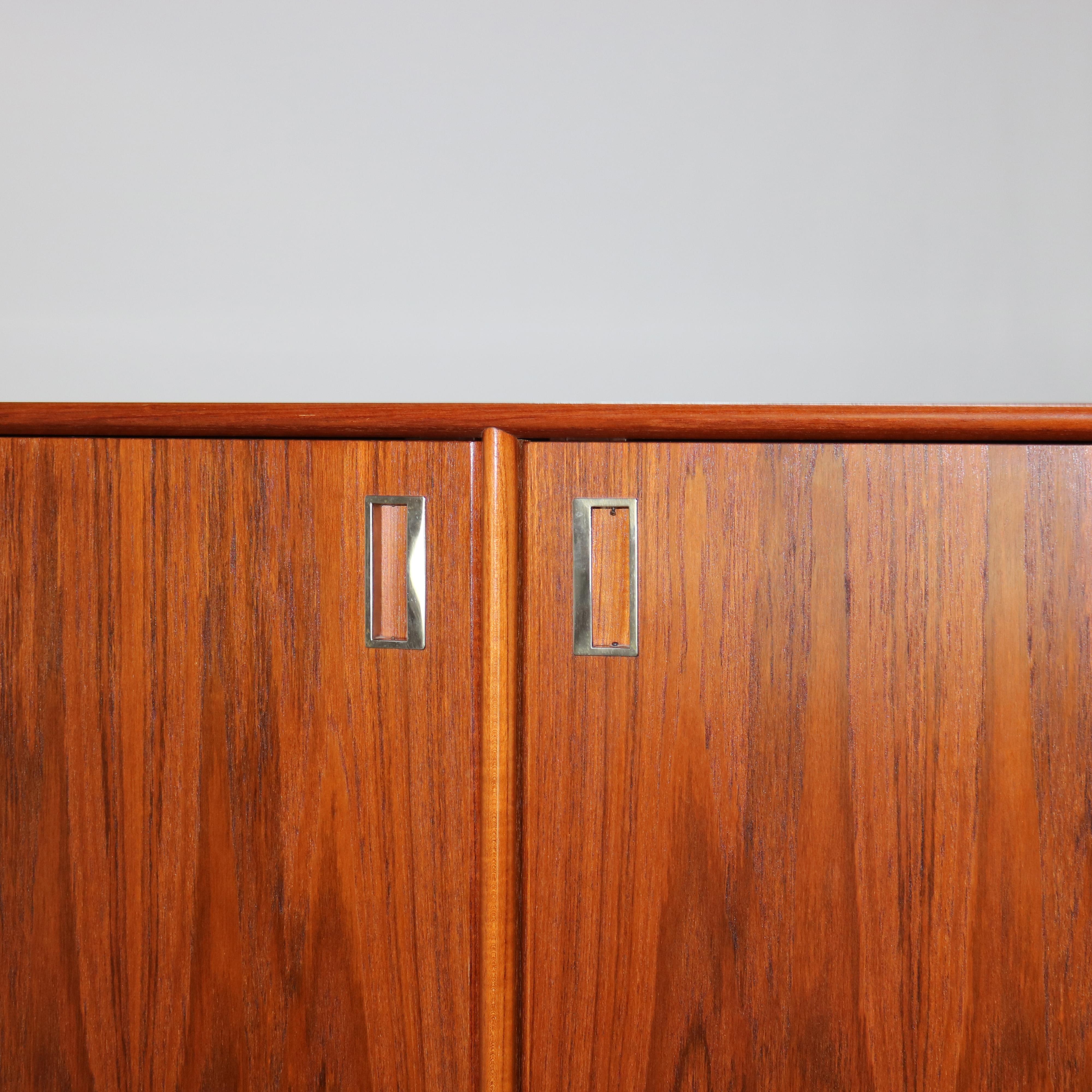 ***Reduced Delivery Rates - See Below or Click “Ask The Seller” to Request a Quote***

Mid Modern Danish Modern Teakwood Double Door Armoire with  Shelves & Drawers 20thC

Measures - 53 3/8