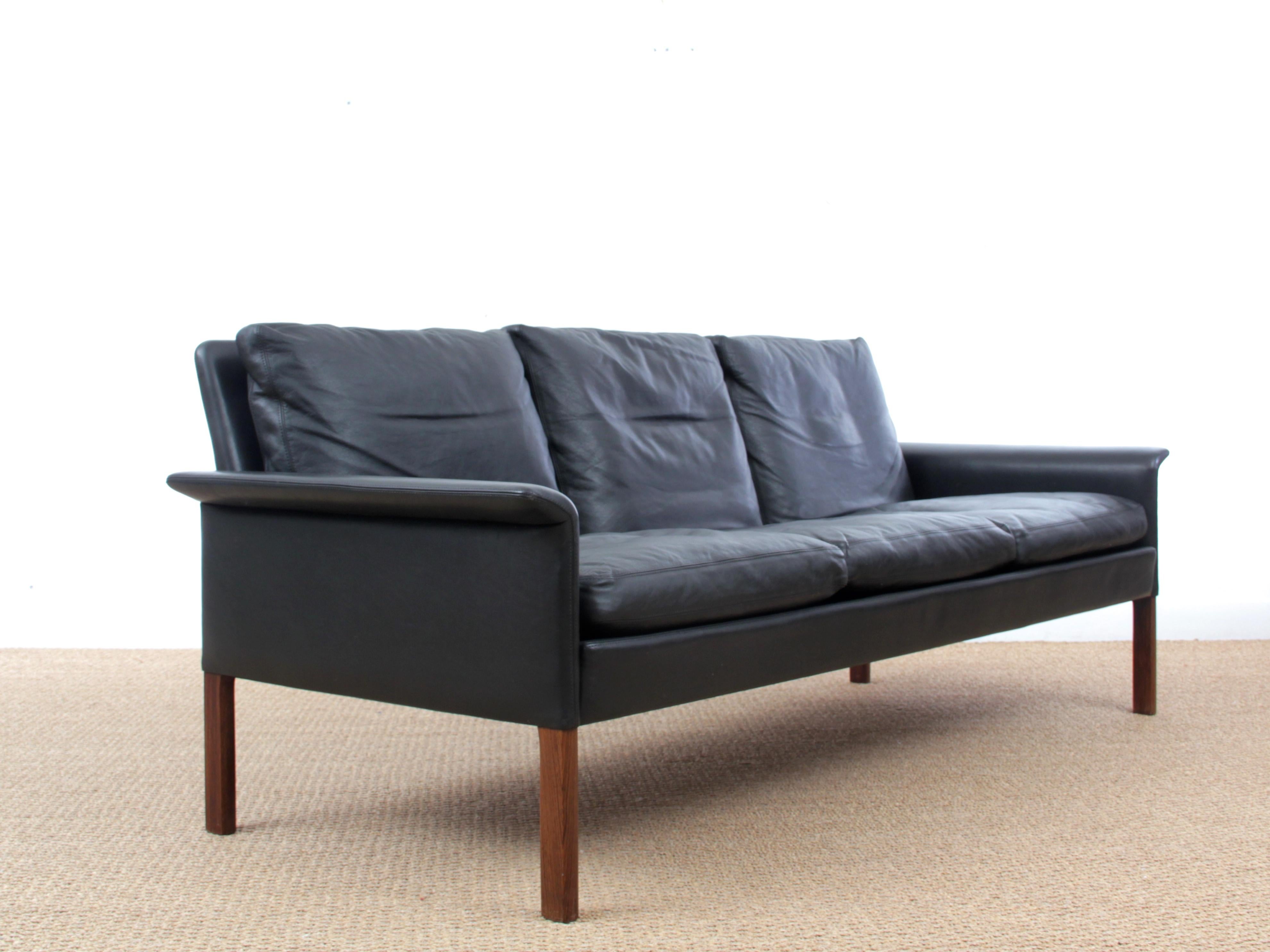 Mid Modern Danish three-seat black leather sofa, model 500 by Hans Olsen. Rosewood legs. New webbing.

Model identified and listed by the Danish Museum of Art and Design. No. RP03547. Literature: Mobilia 1962 no. 79.

 