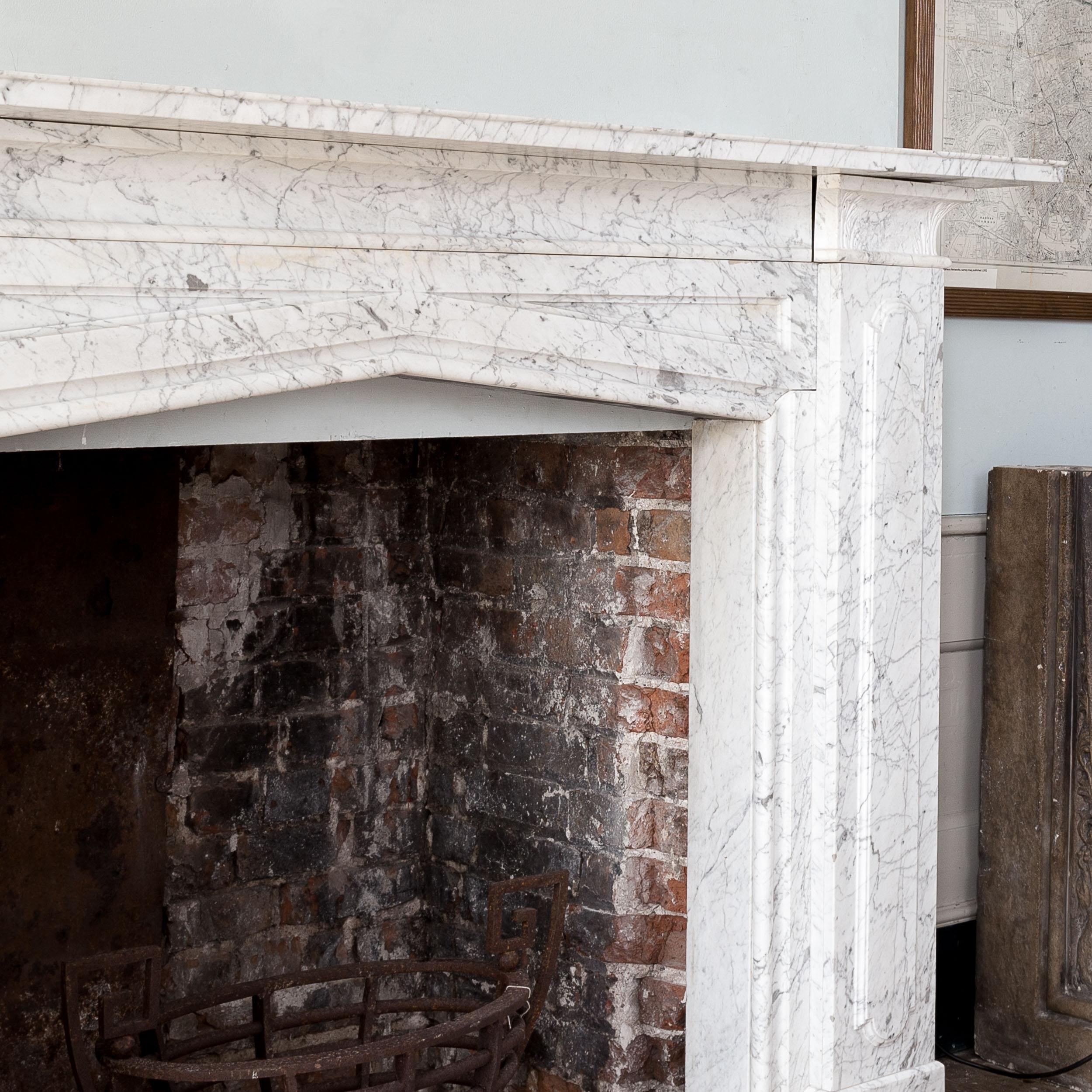 Carrara Marble Mid-Nineteenth Century 'Old English' Marble Fireplace