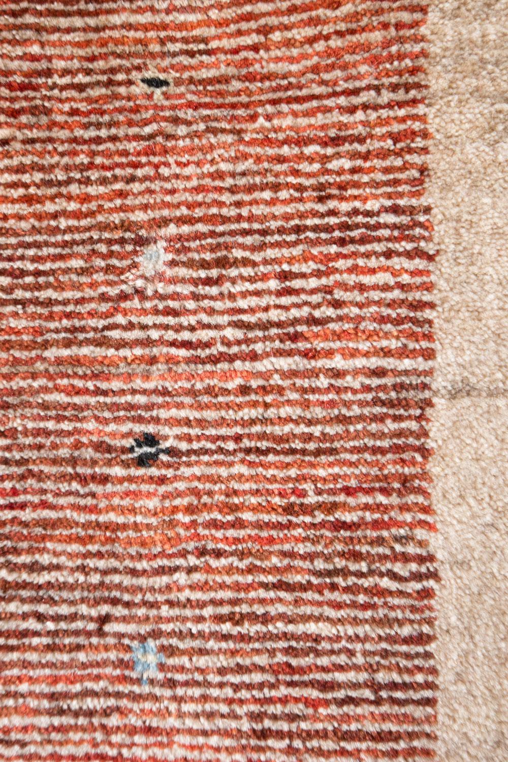 Mid-size soft red and neutral contemporary Gabbeh Persian wool rug. The barest of geometrics, this red form on the backdrop of undyed, light neutral sums up the Gabbeh in a short, straightforward manner. It's beautifully crafted of fine, hand-tied
