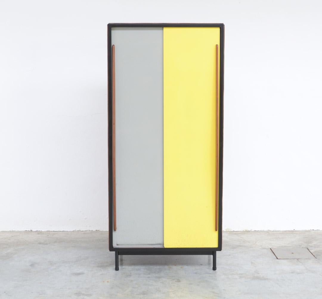 This medium wardrobe cabinet was designed by the Belgian designer Willy Van Der Meeren for Tubax in the early 1950s.
It is a classic example of the midcentury Belgian social furniture design: those cabinets were used in schools and factories.
This