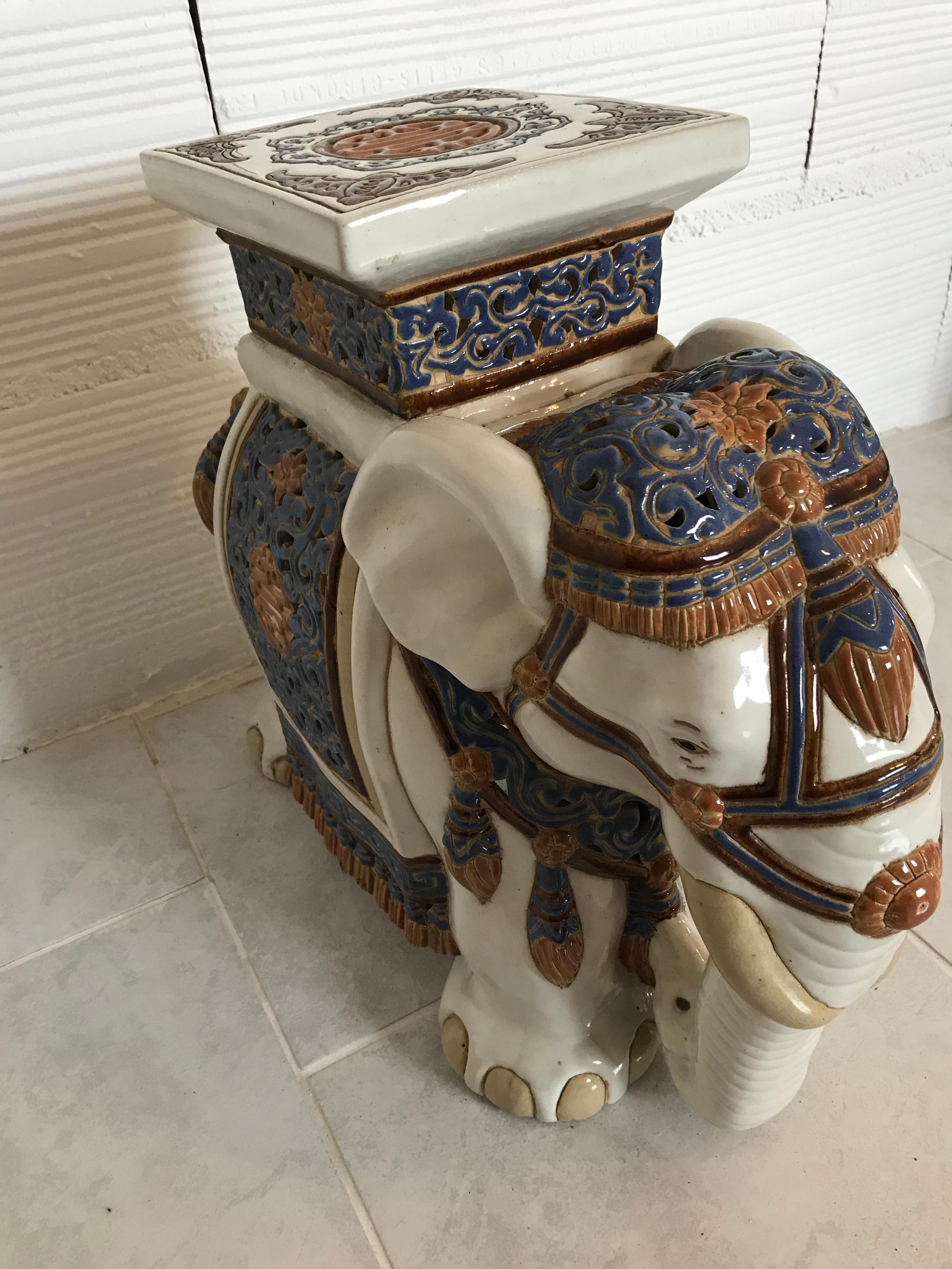 Mid to late 20th century glazed ceramic elephant garden stool, flower pot stand, seat or side table. Handmade of ceramic. Very nicely pierced, this is a quality example still retaining fine definition around the eyes and crisp colouring. The