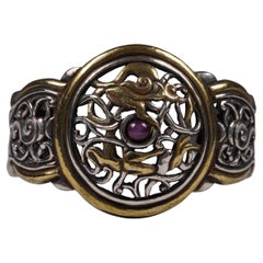 Brazalete de plata y baño de oro de mediados y finales del siglo XX con motivo tibetano