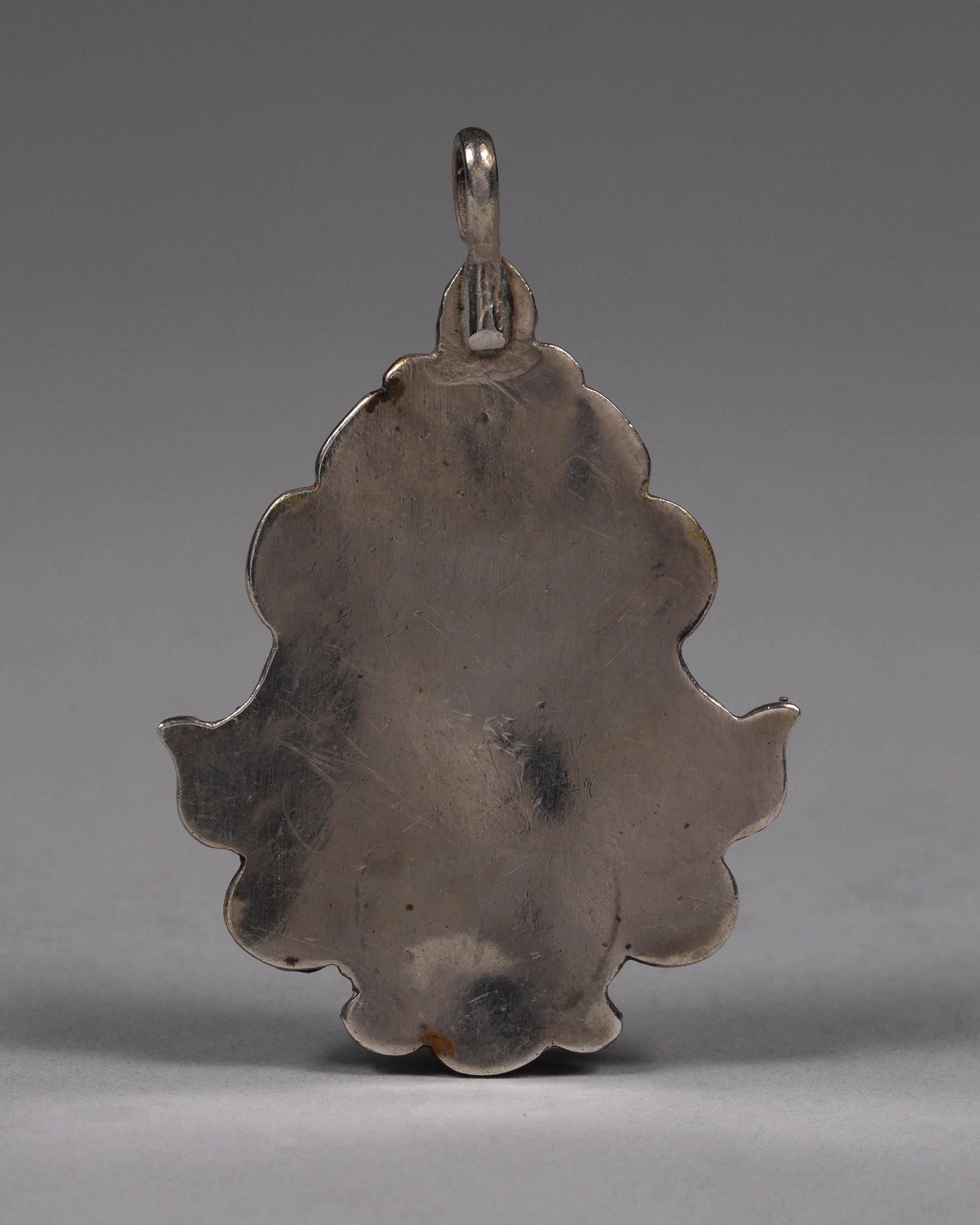 Mid to Late 20th Century Silver and Gold Plate Auspicious Elements Pendant with Tibetan Motif

Silver pendant with gold plate and carnelian stone depicting the Astamangala. The 8 auspicious emblems, symbols of good fortune, are considered a teaching