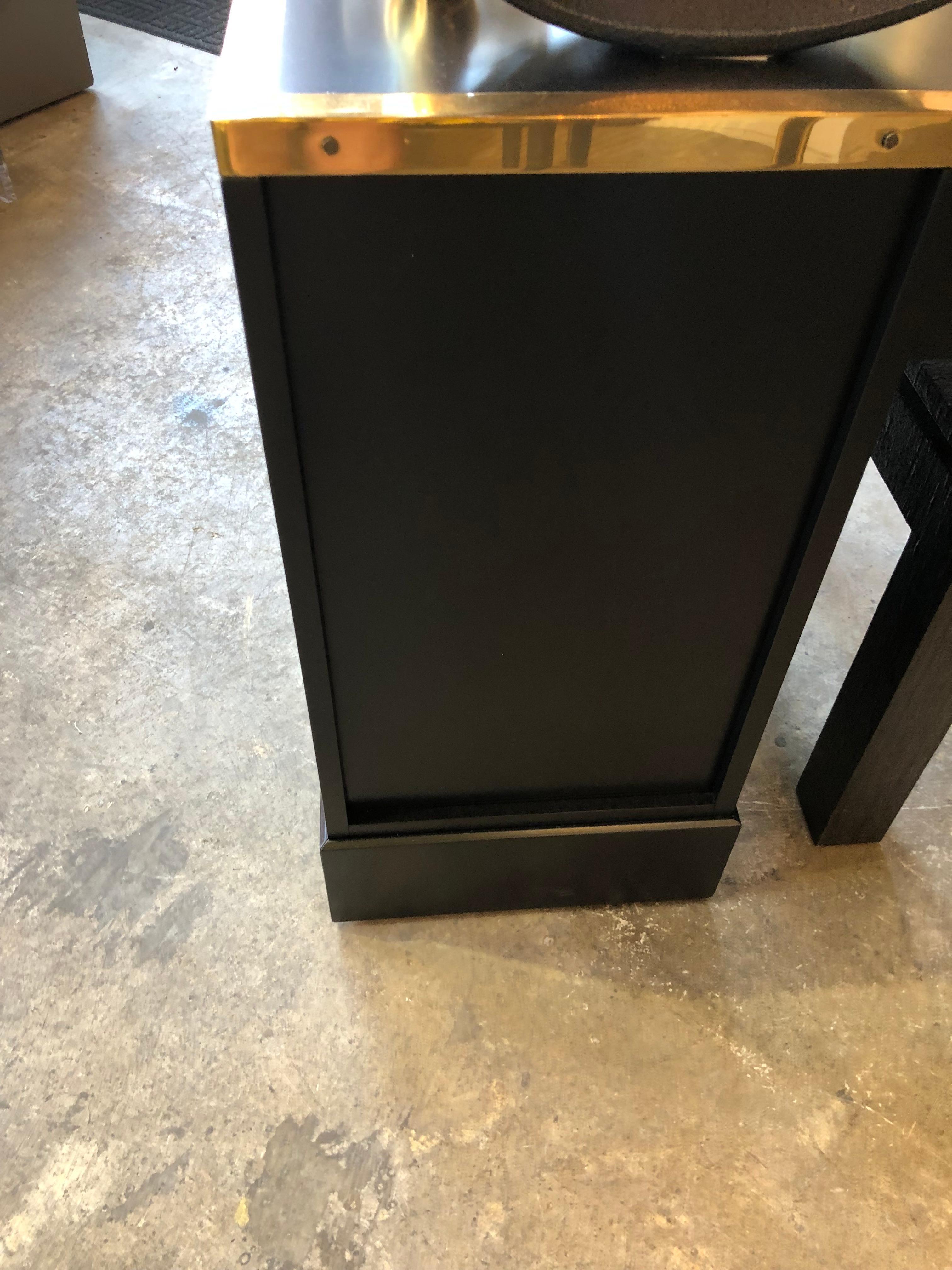 A 1970s brass-clad black hardwood Campaign style desk by Directional.