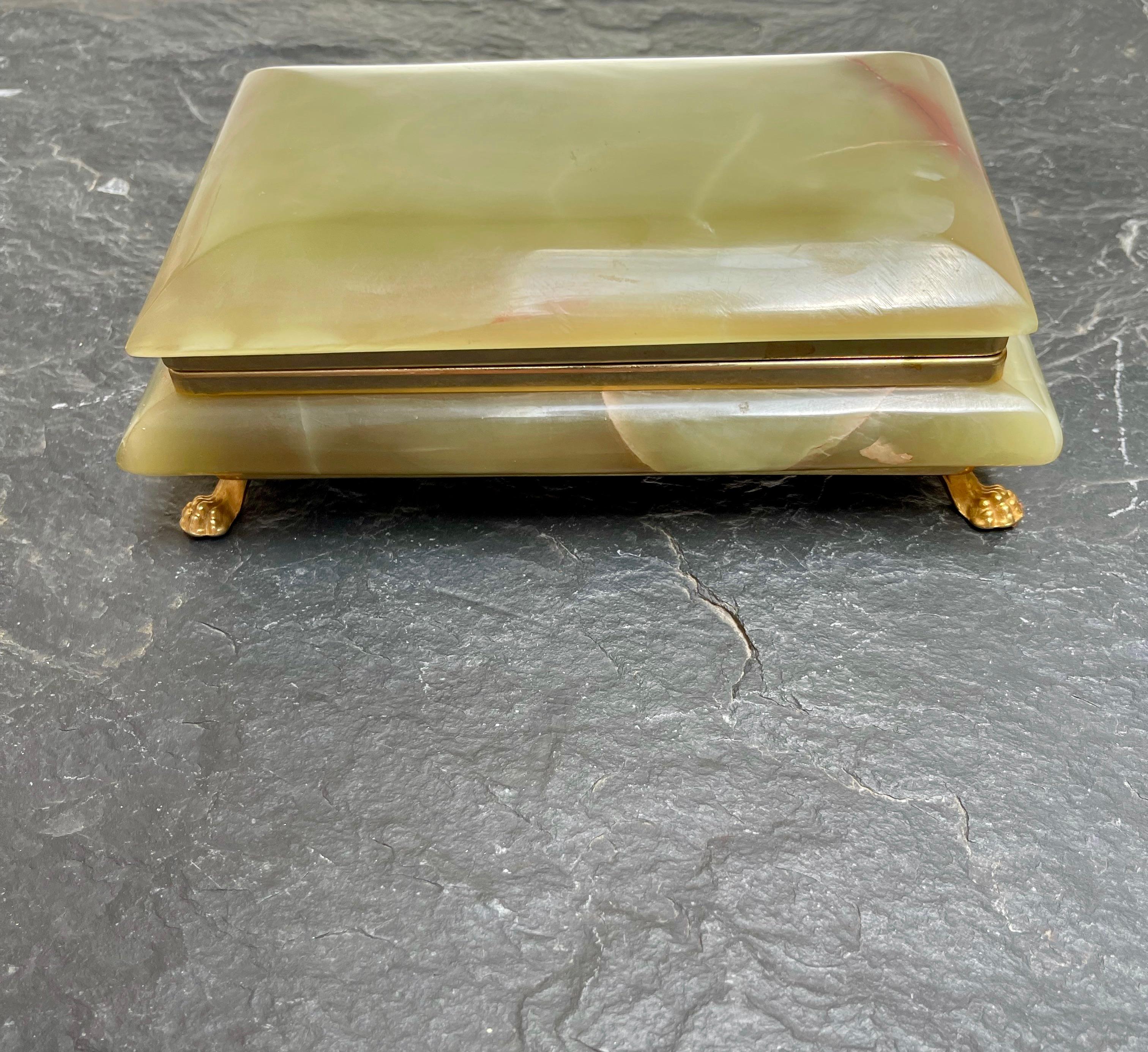Wonderfully hand-crafted and excellent condition, late 20th century box.

This hand-crafted box from mid to late 20th century Italy is made of the most beautiful green onyx. This natural mineral stone box is shaped in a very stylish Roman classical