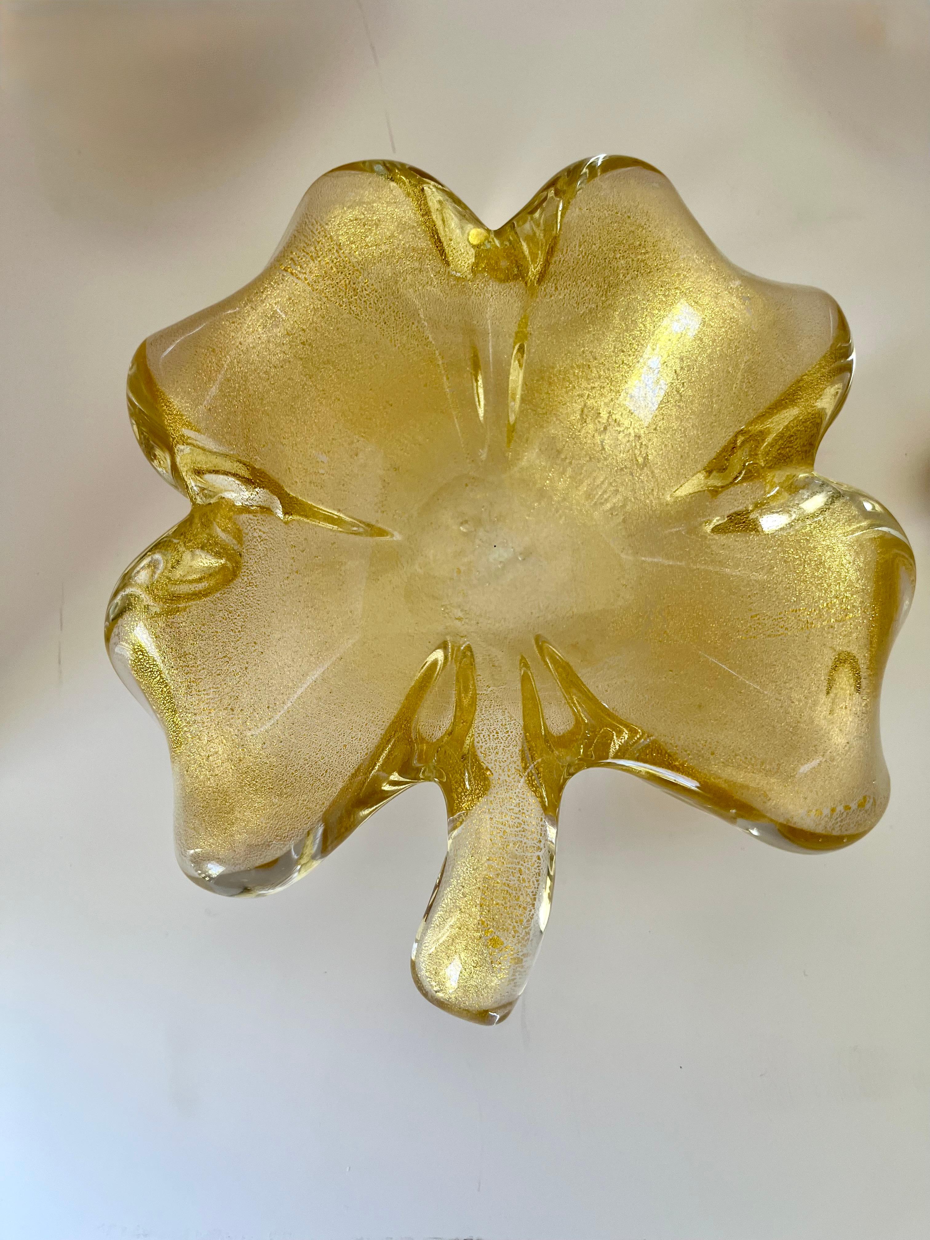 Mid -Twentieth Century Italian Murano Art Glass  4 -piece bowl set with gold dust (most likely) aventurine designed -by Archimede Seguso . The large dish is a figural leaf form  The ball could possibly represent friendship and good luck. Two