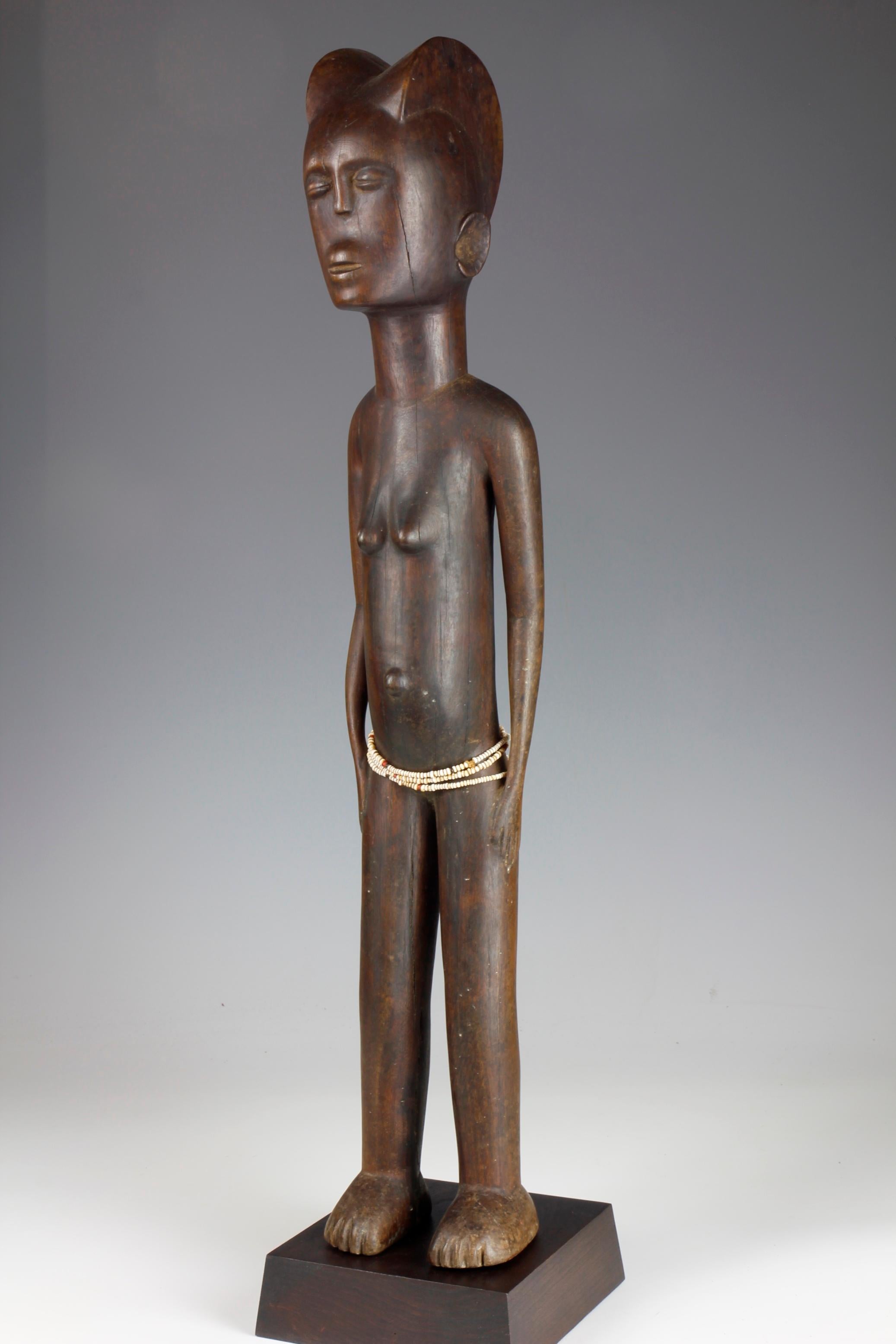 Tanzanian Mid-Twentieth Century Tall Female Figure With Bead Decoration For Sale