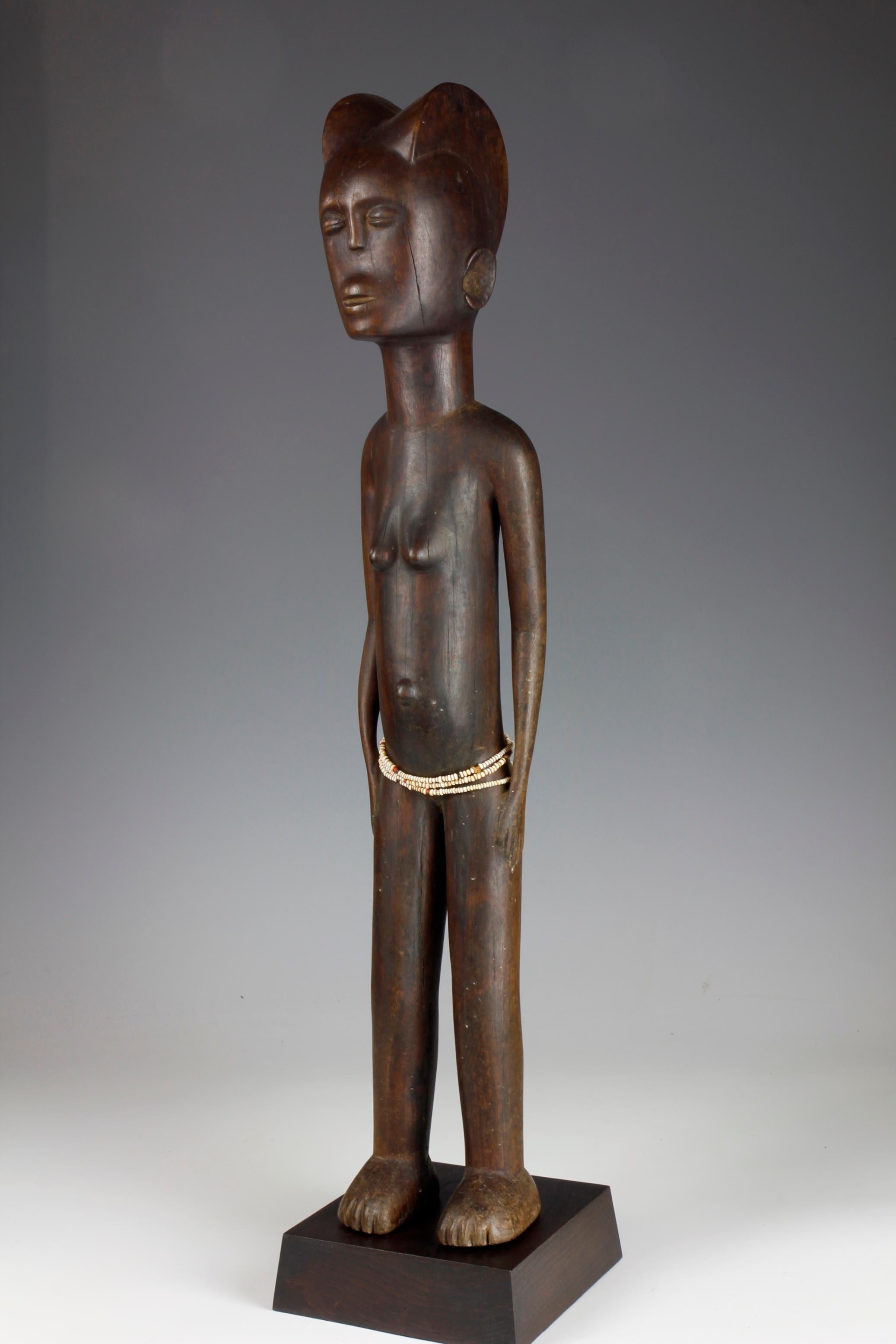 Carved Mid-Twentieth Century Tall Female Figure With Bead Decoration For Sale