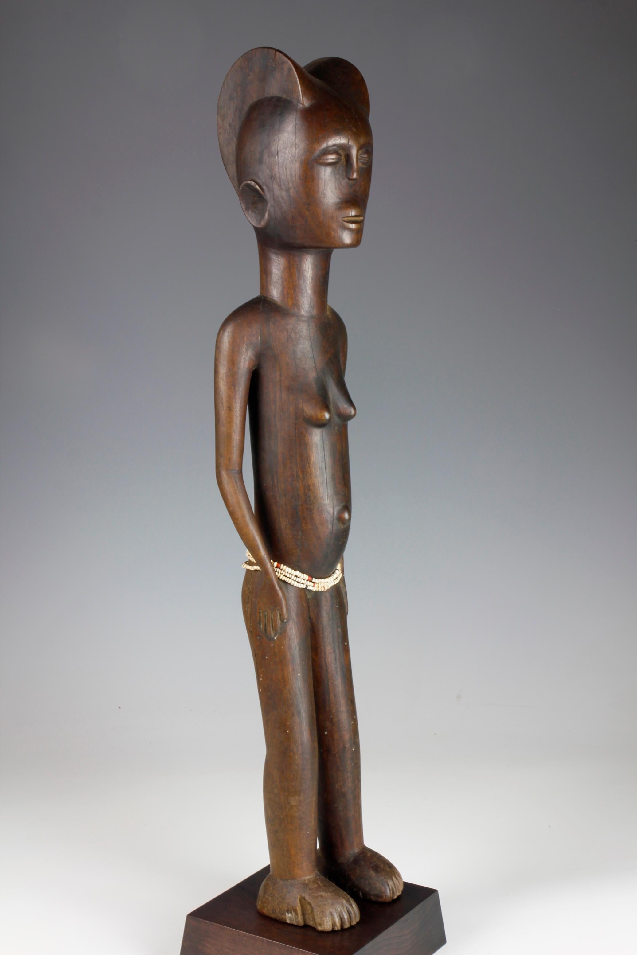 Hardwood Mid-Twentieth Century Tall Female Figure With Bead Decoration For Sale