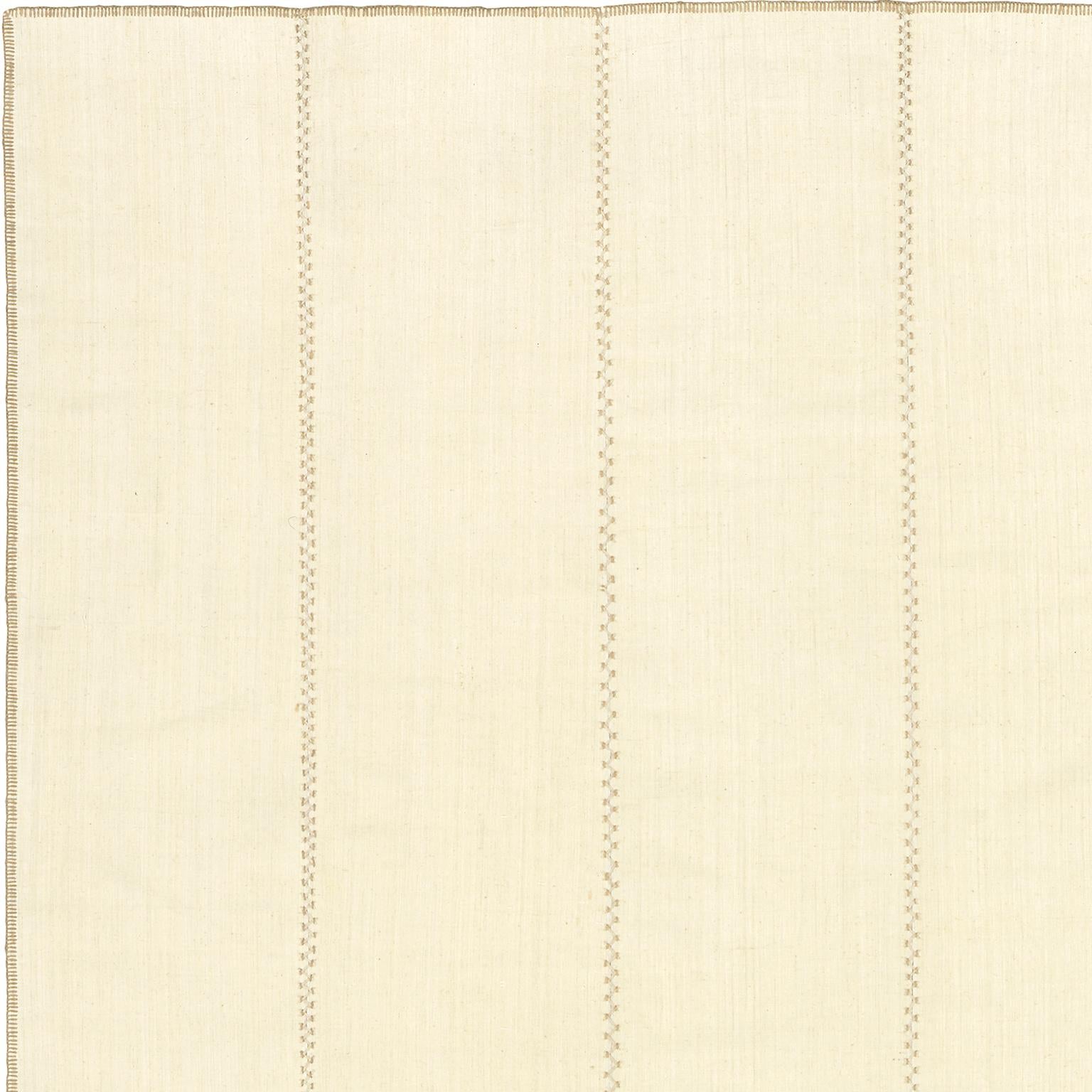 Linear design. Turkish cream colored panels with linen and wool stitching
Measures: 12'6