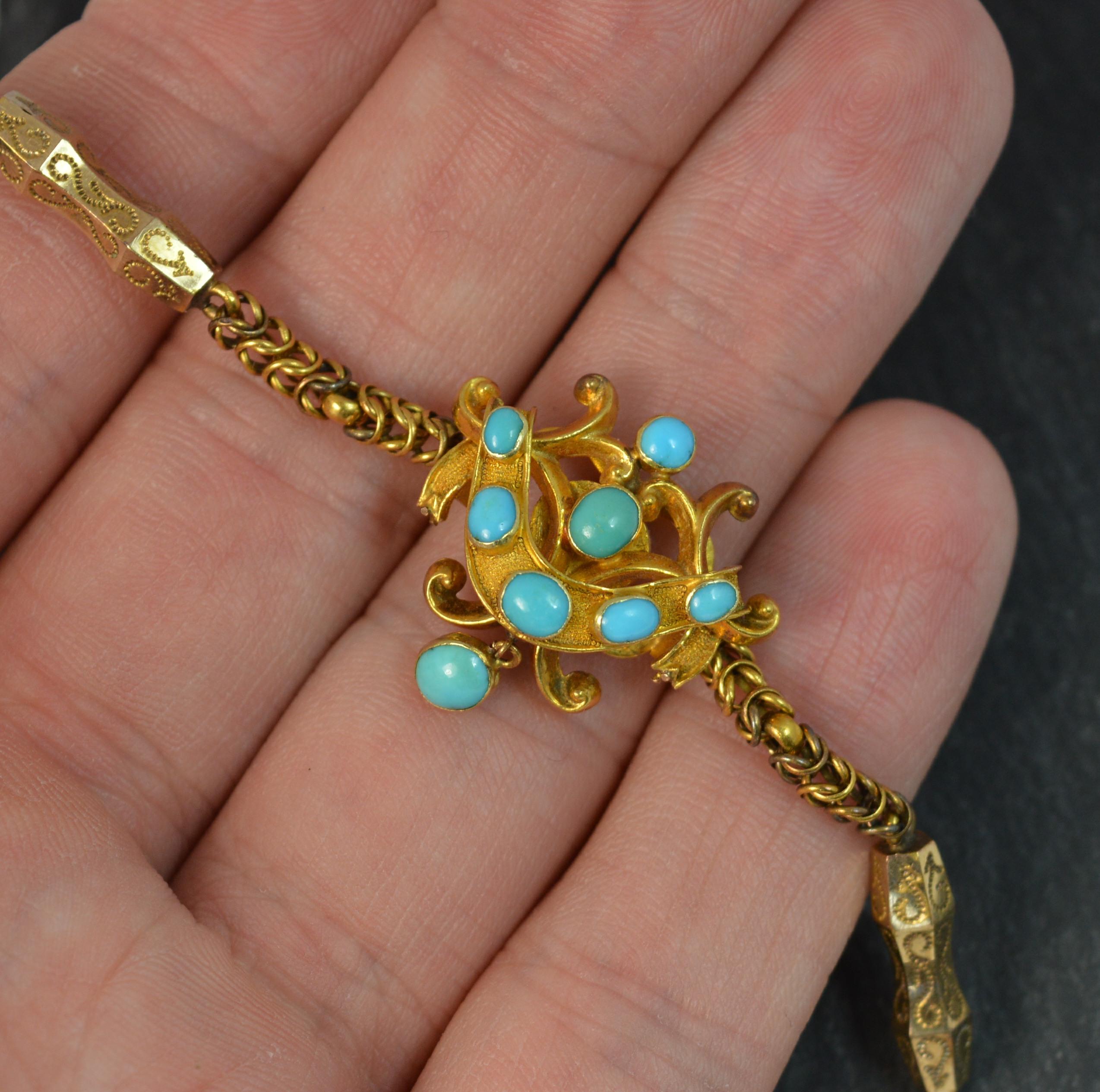 A superb mid Victorian period example. c1860

Designed with a cluster panel set with turquoise to the front and locket section to reverse.

Fancy link example with snake like links and engraved sections in between.

Solid 15 carat yellow gold