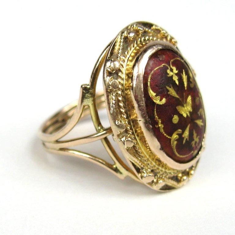 Lovely gold inlay Spray set in a Garnet. Ring is a 6.5