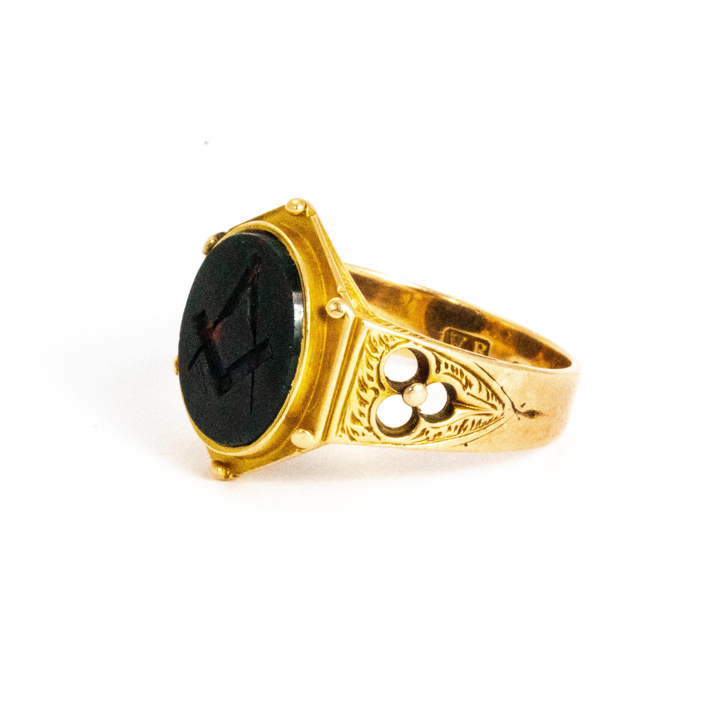 This stunning example of a Victorian Masonic ring has such a decorative 15ct gold band and holds a glossy intaglio bloodstone. The engraved bloodstone shows a compass and set square, this rind was created in Birmingham UK in 1873.

Ring Size: T 1/2