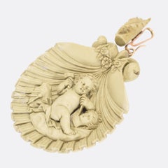 Mid-Victorian "Cupid Carving Aphrodite" Lava Cameo Pendant