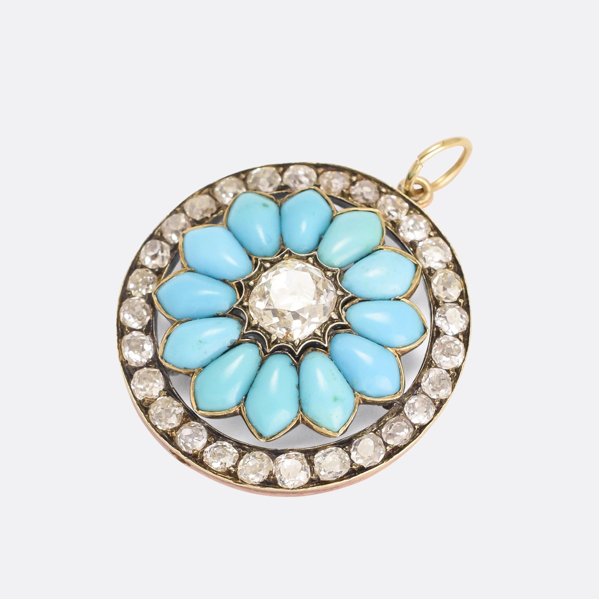 A stunning mid-Victorian halo flower pendant, set with unusually shaped turquoise cabochon petals around a central 1.25ct cushion cut diamond. The halo boarder is set with further old mine cut diamonds, and the piece dates from the 1870s. It's