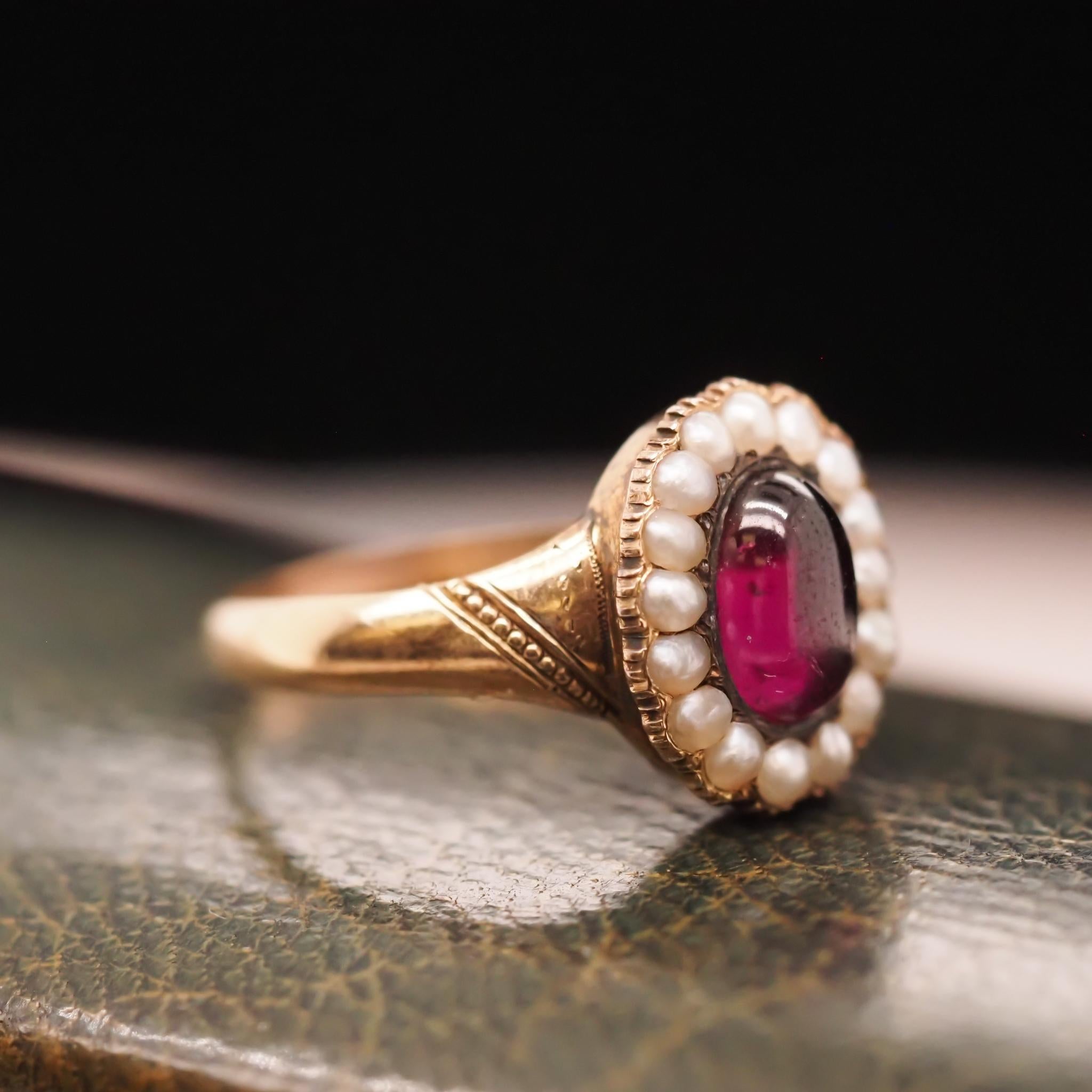 Year: 1863 (Engraved on inner shank)
Item Details:
Ring Size: 7
Metal Type: 9k Yellow-Rose Tone Gold [Hallmarked, and Tested]
Weight: 3.0 grams
Center Details: Tourmaline, Deep Purple, 7.7mm x 5.25mm, Natural
Side Stone Details: Seed Pearls, 2mm