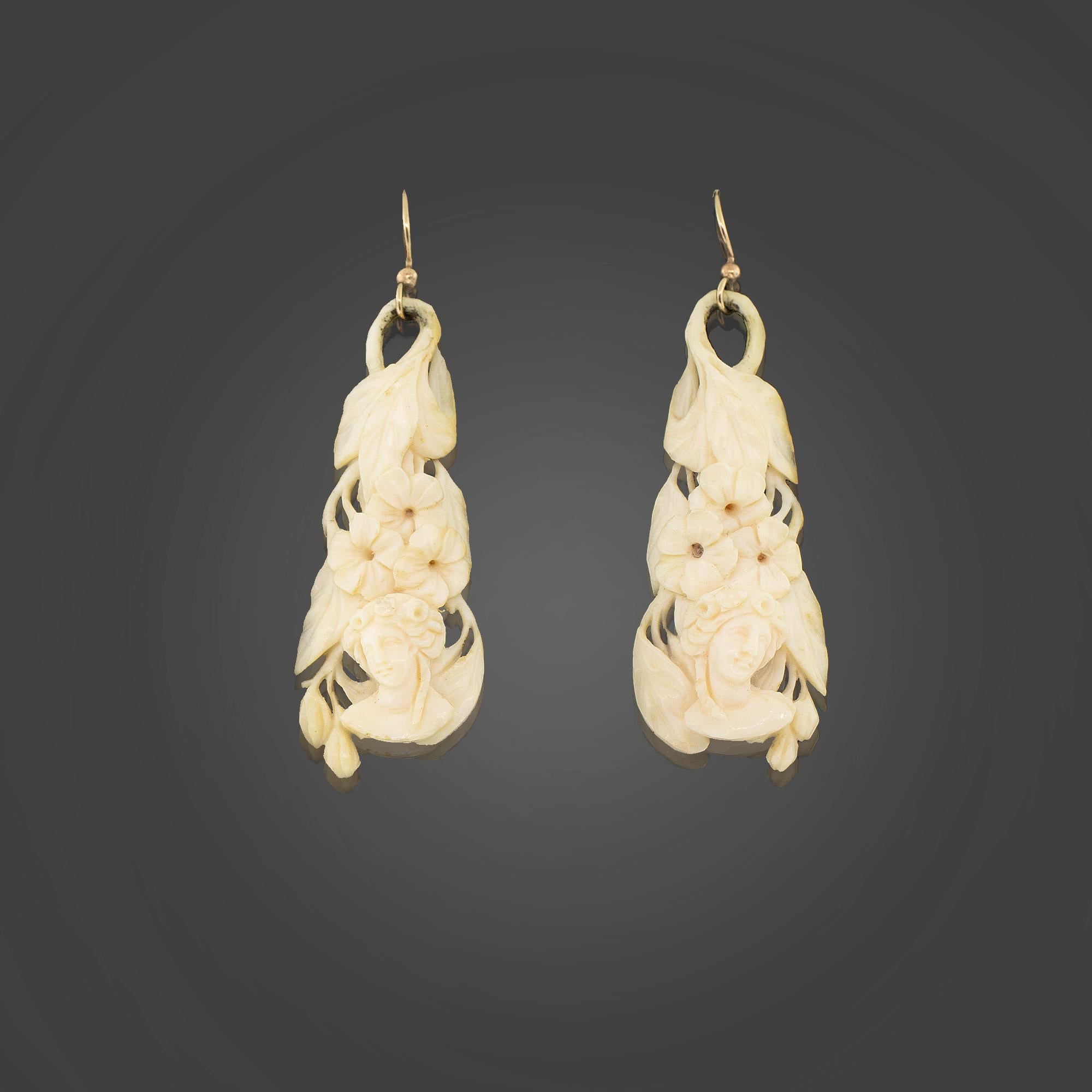 One Pair of mid-Victorian hand carved ivory drop earrings. Featuring with a woman in cameo relief with a floral background. Fitted with 9k gold shepherd’s hooks.

Metal: 9k yellow gold
Weight: 8.38 grams
Measurements: Length 6.5cm
Era: Mid-Victorian