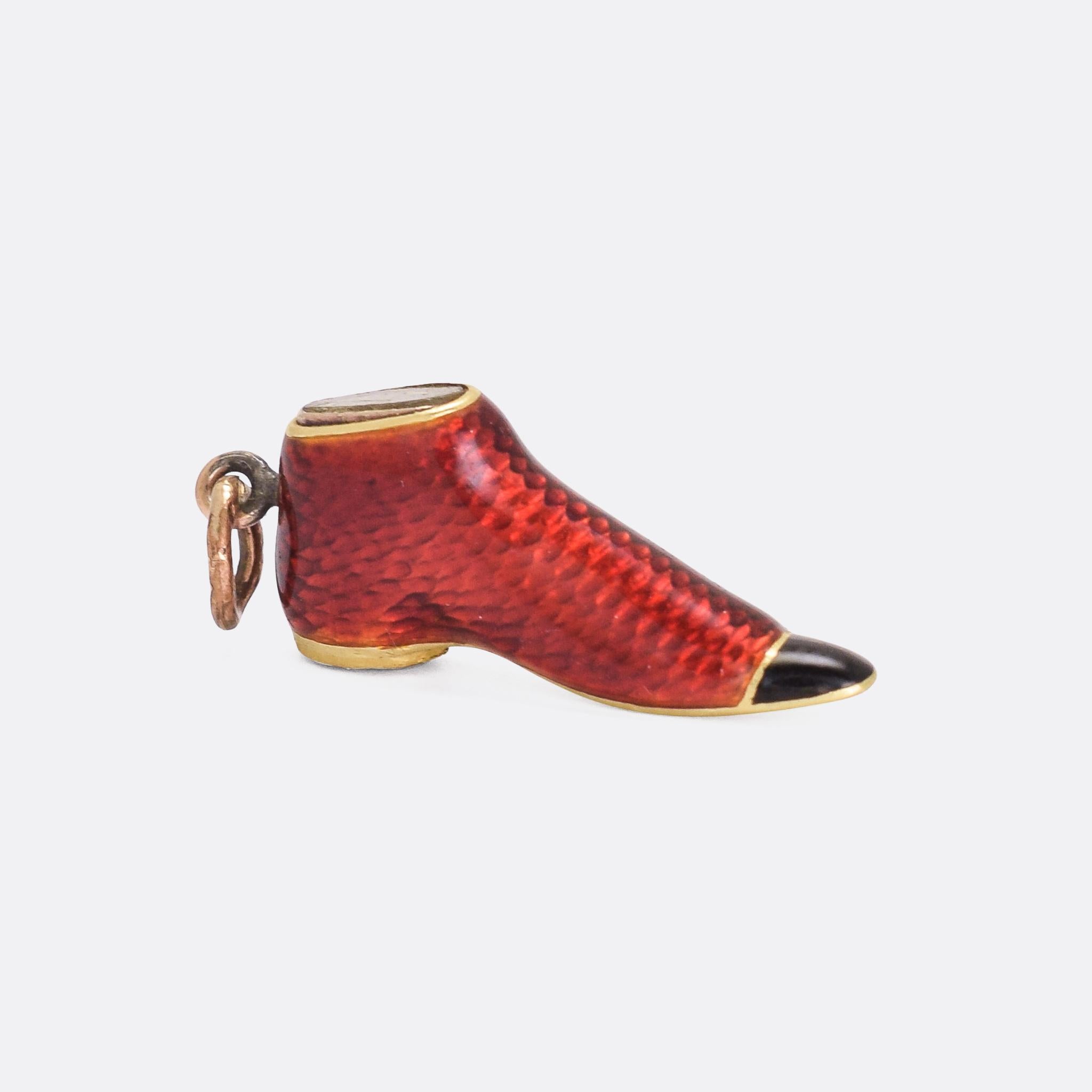 A cool and unusual antique charm, modelled as an old fashioned red and black shoe. It's finished in fine guilloché enamelling, and features an oval locket compartment in the top and a chalcedony seal in the heal. Pretty neat, right? I bet you've