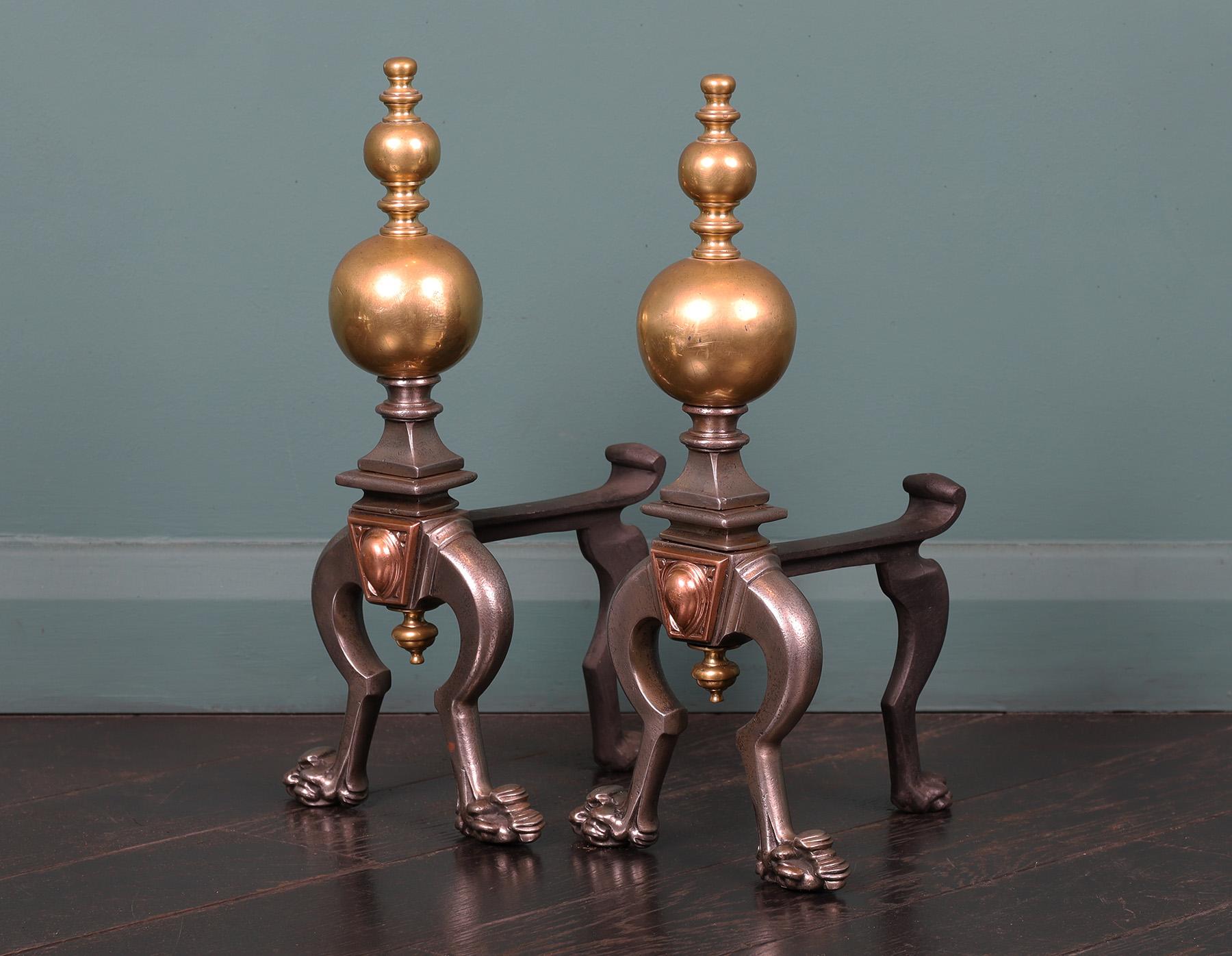 Mid-Victorian steel, brass & bronze fire tool stands. Bulbous brass spheres sit on plinth with bronze central detail on paw feet. Restored.
Circa 1850